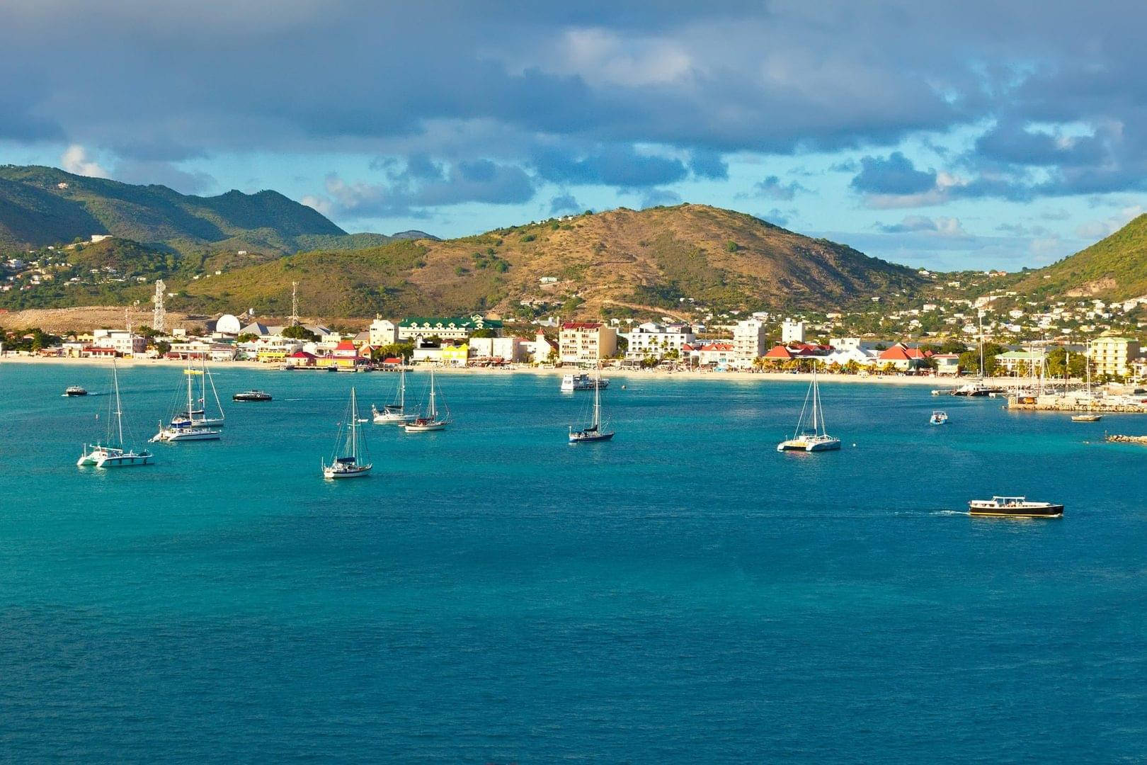 Sailboats On Sint Maarten's Coast Background