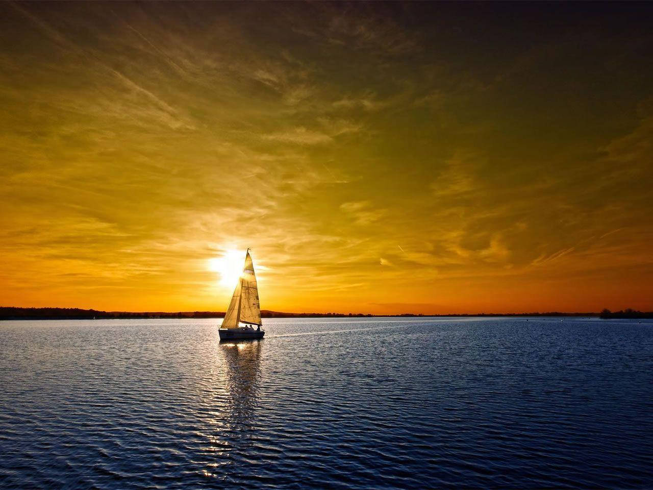 Sailing Boat And Ocean Sunset