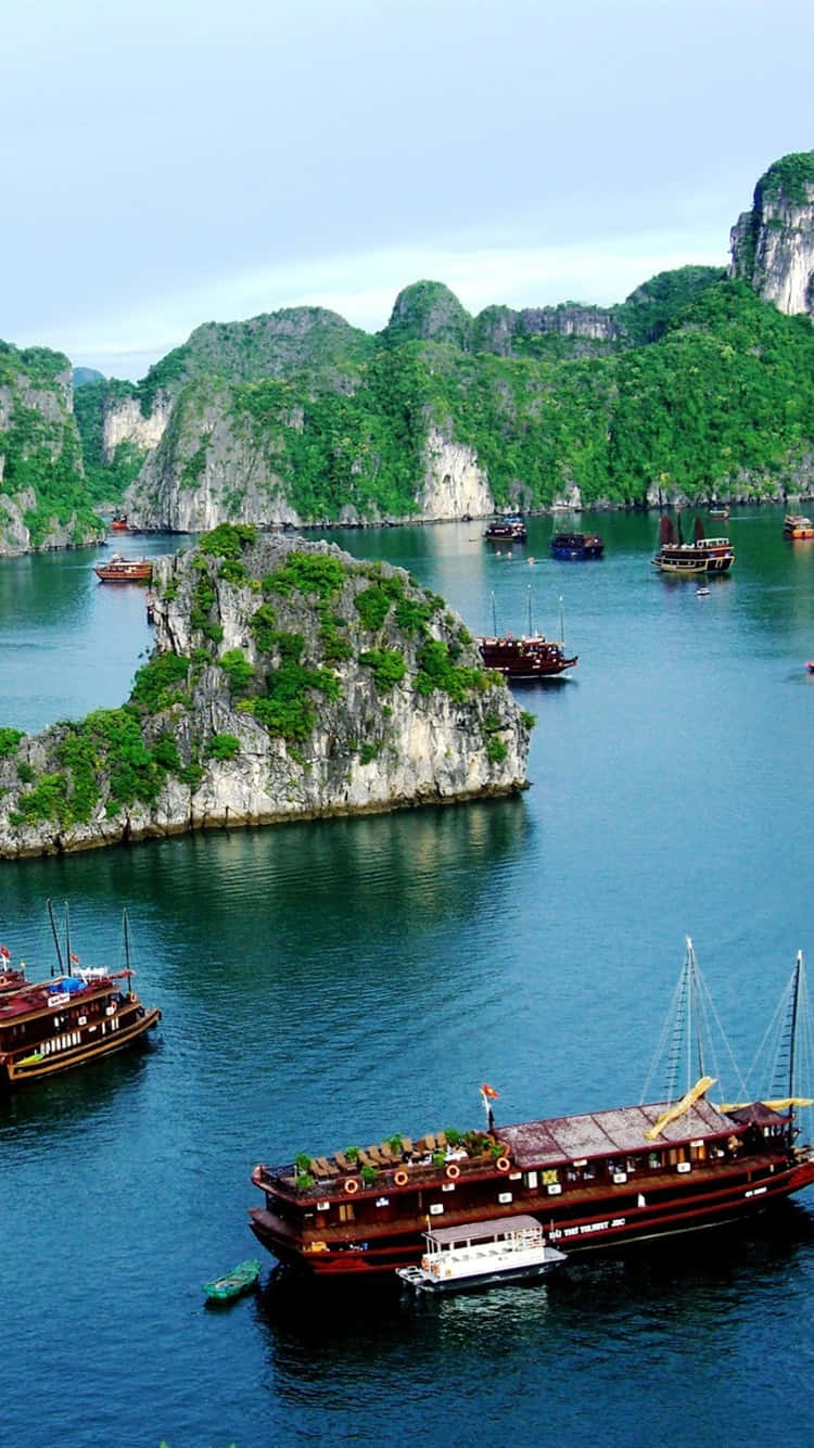 Sailing Ships On Halong Bay In Vietnam Background