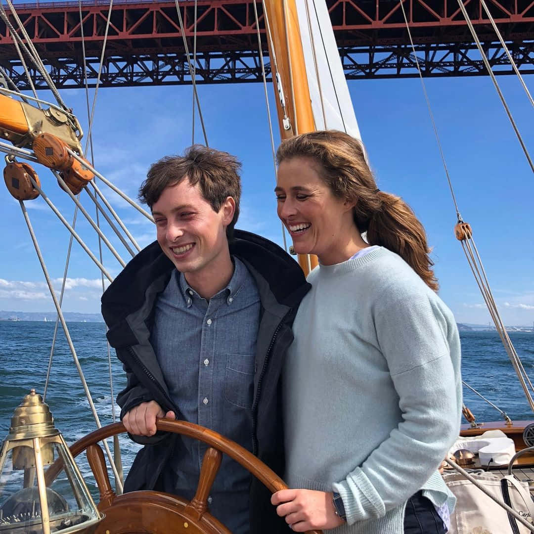 Sailing Smiles Under Bridge