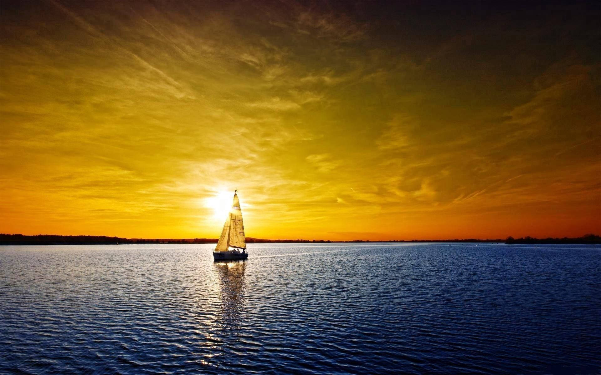 Sailing Under Orange-hued Skies Background