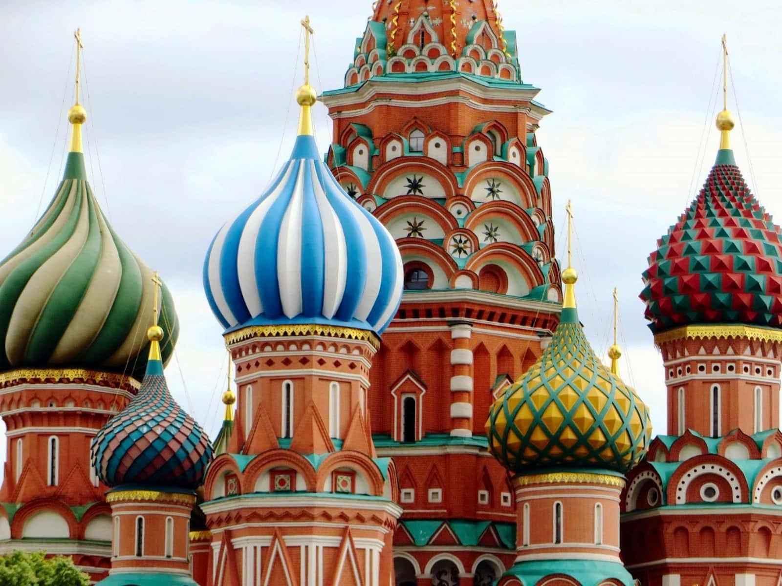 Saint Basil's Cathedral Steeples With Festive Colors And Shapes Background