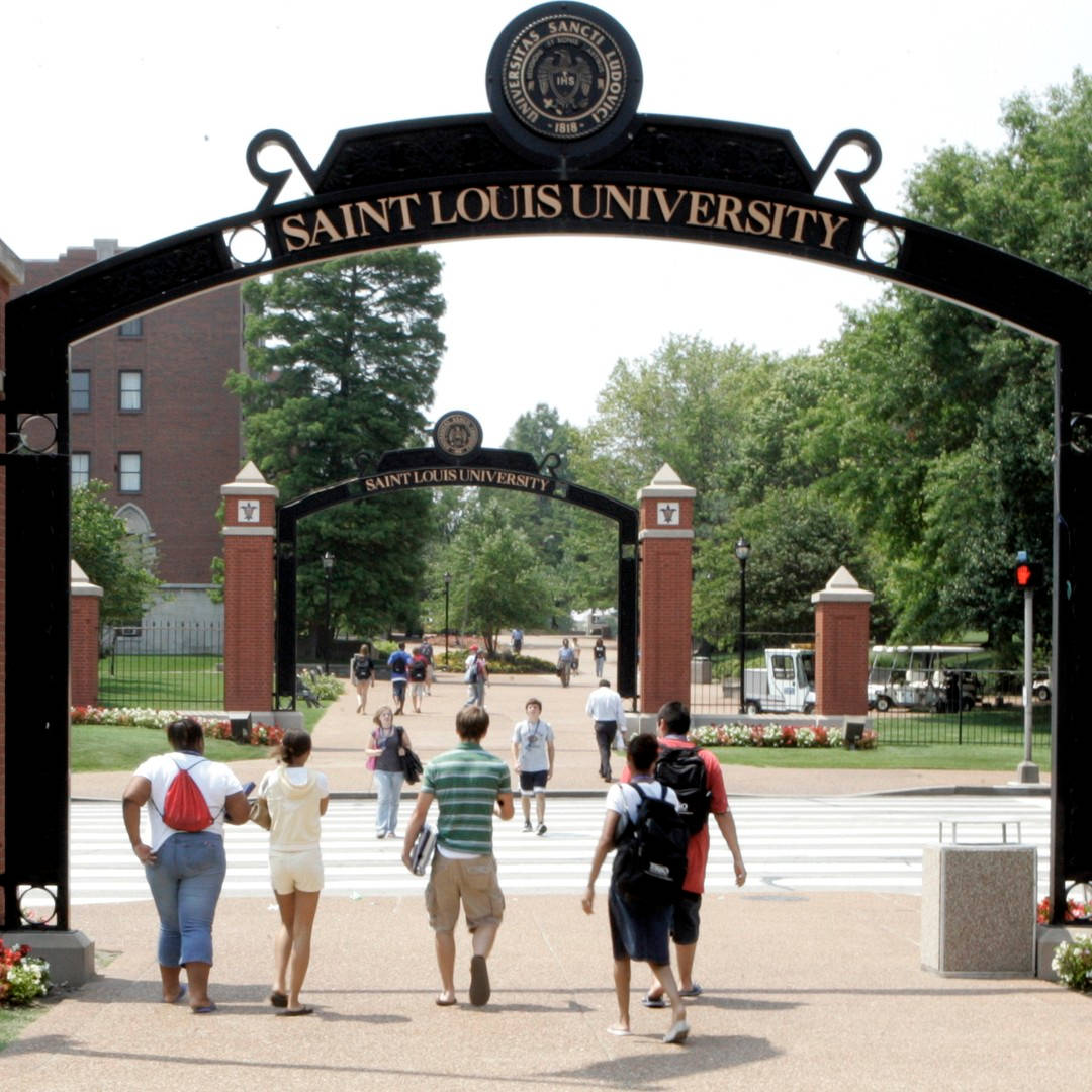 Saint Louis University Students Under Arches Background