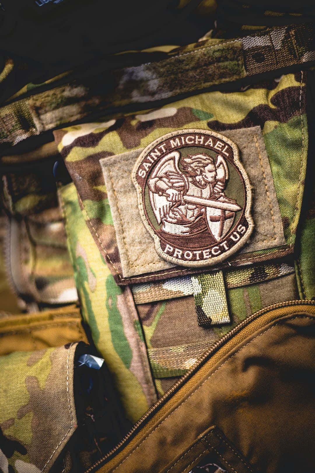 Saint Michael The Archangel In Battle Background