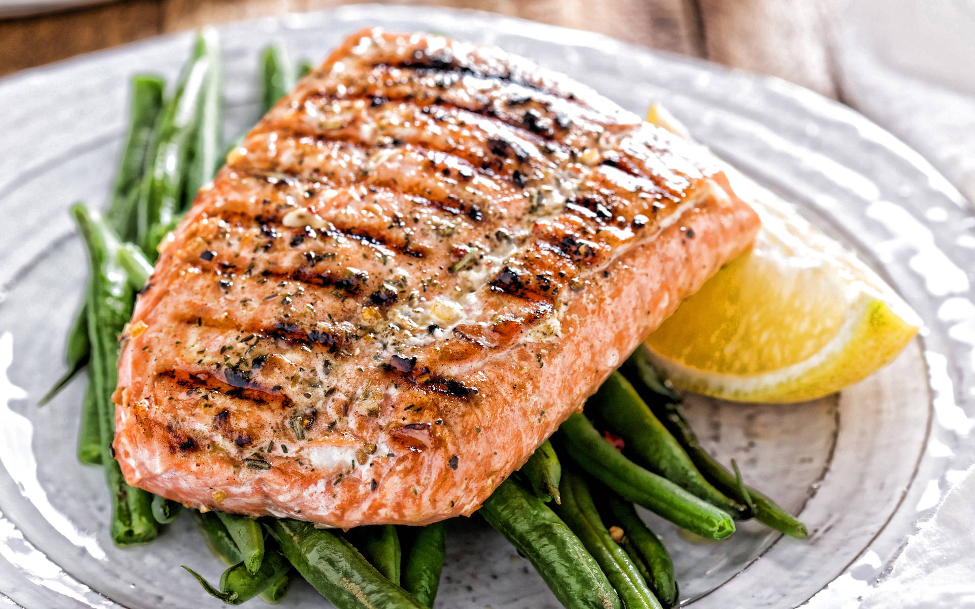 Salmon Grilled With Asparagus And Lemon On White Plate Background