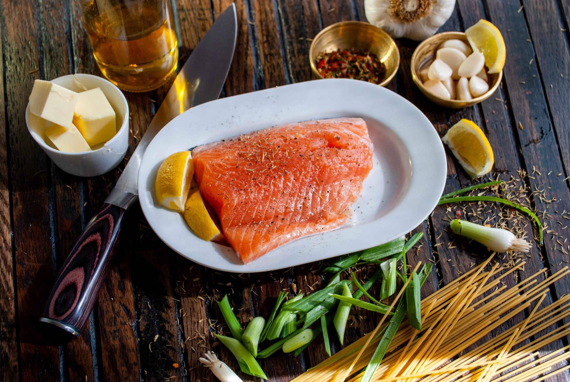 Salmon On Plate With Spices And Lemon Background