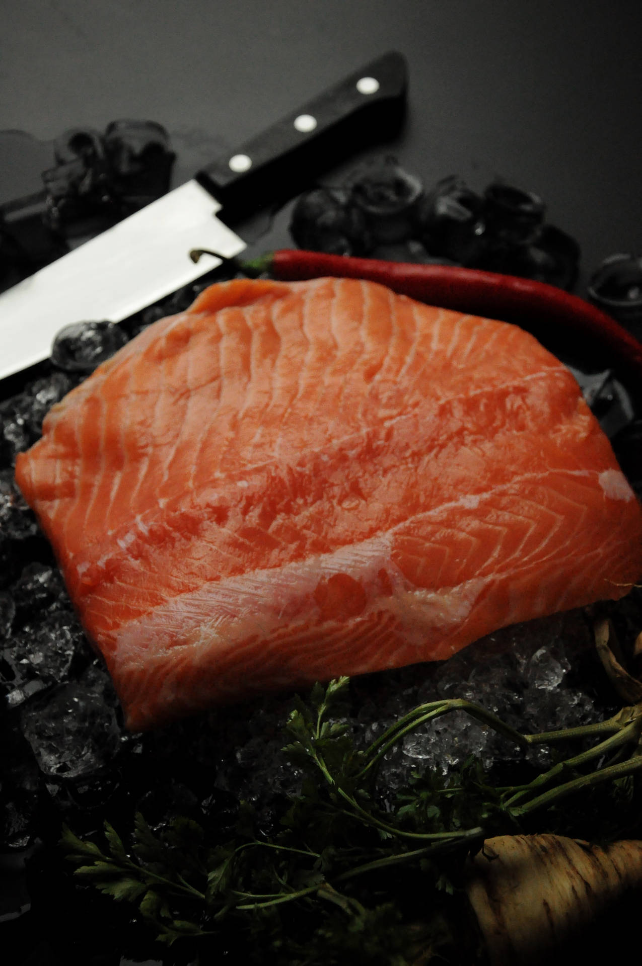 Salmon Raw With Seaweed And Knife Background