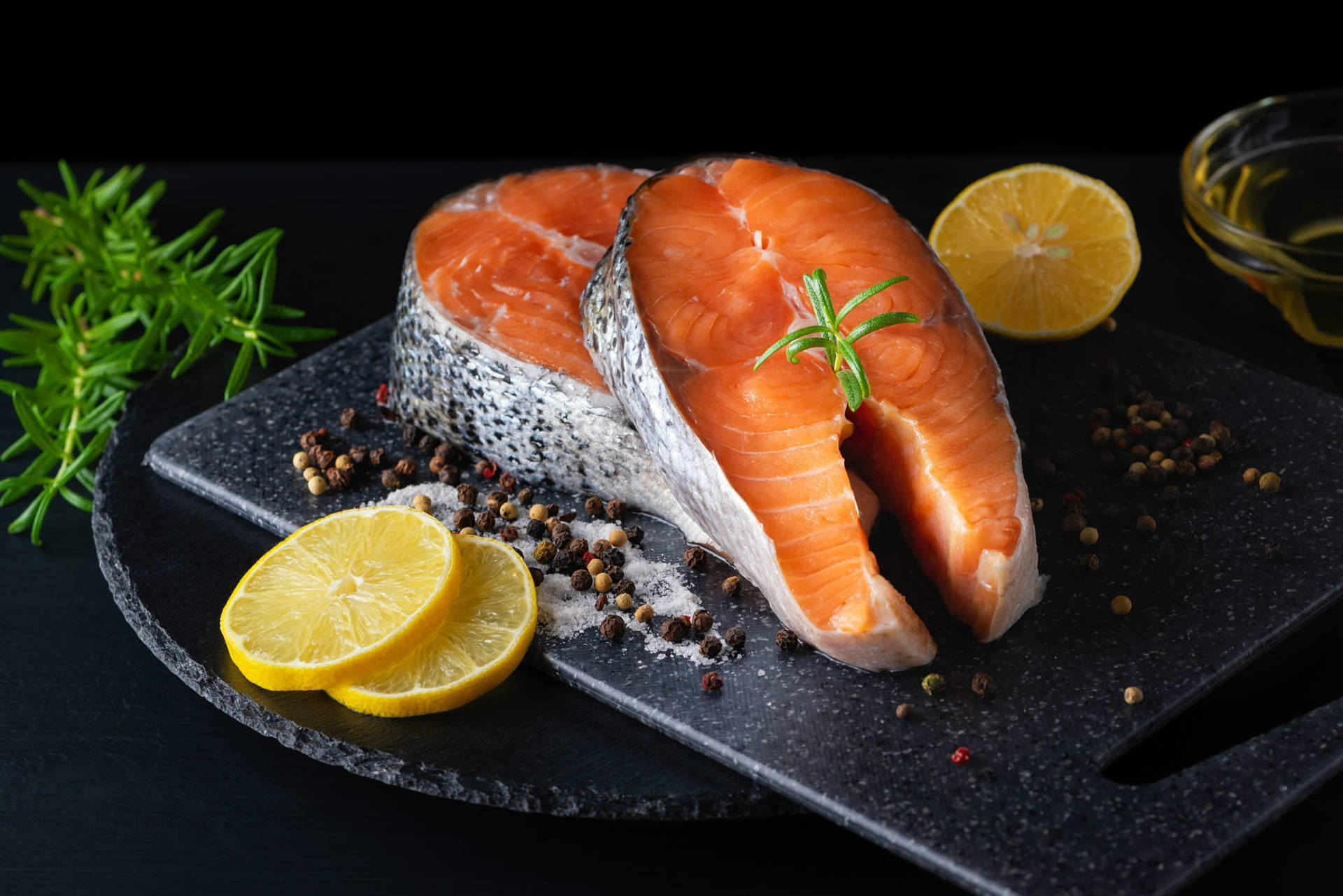 Salmon Steak With Peppercorn And Lemon Background