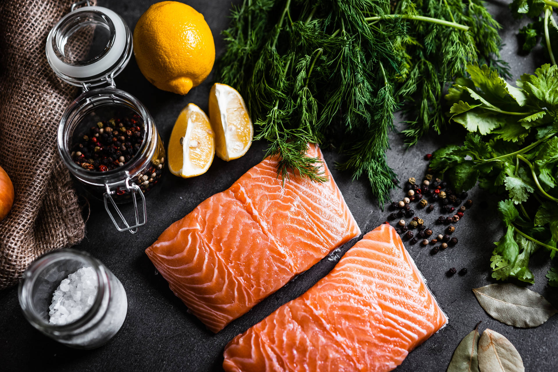 Salmon Uncooked With Herbs And Lemon Background