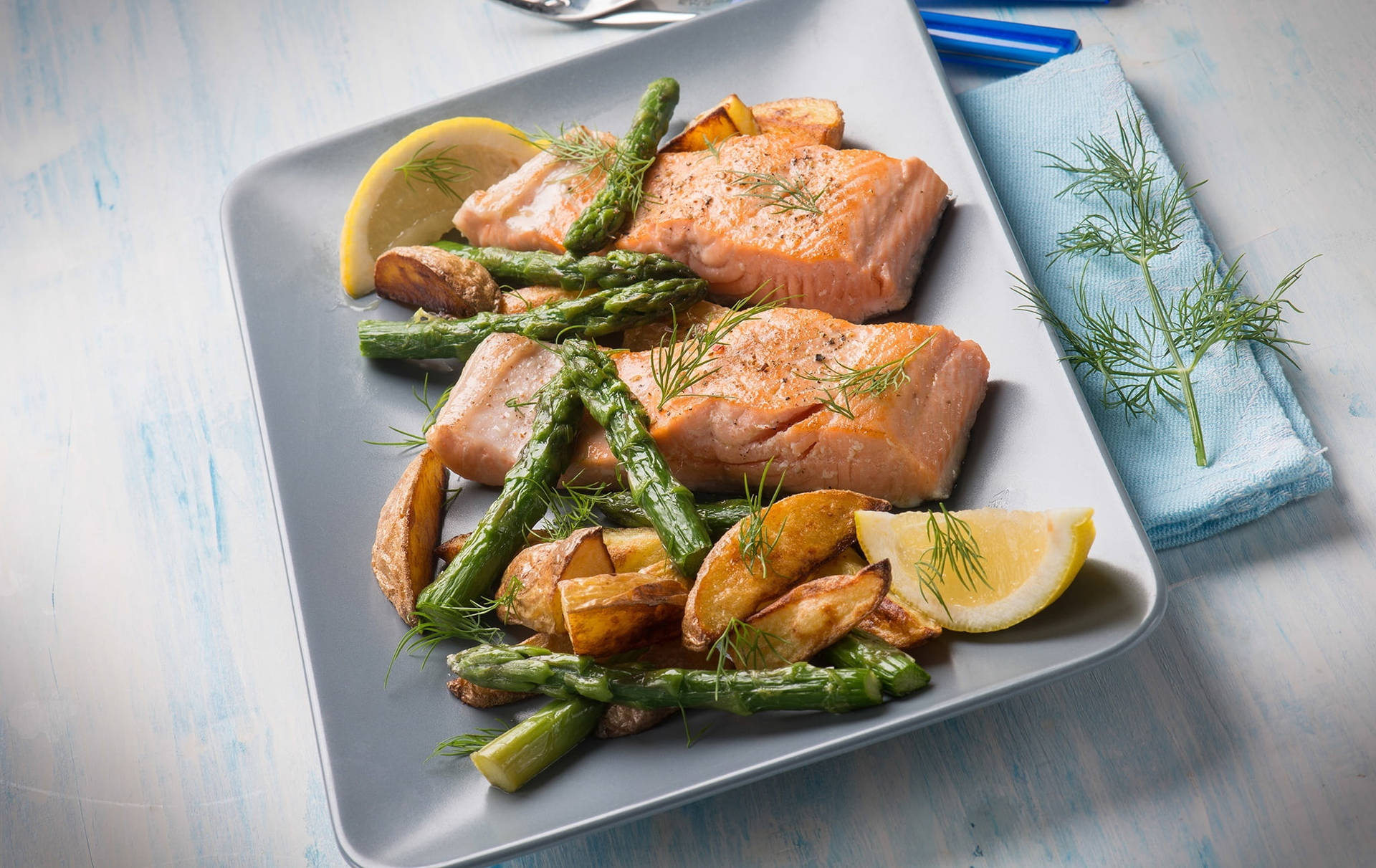 Salmon With Asparagus And Potato Wedges Background