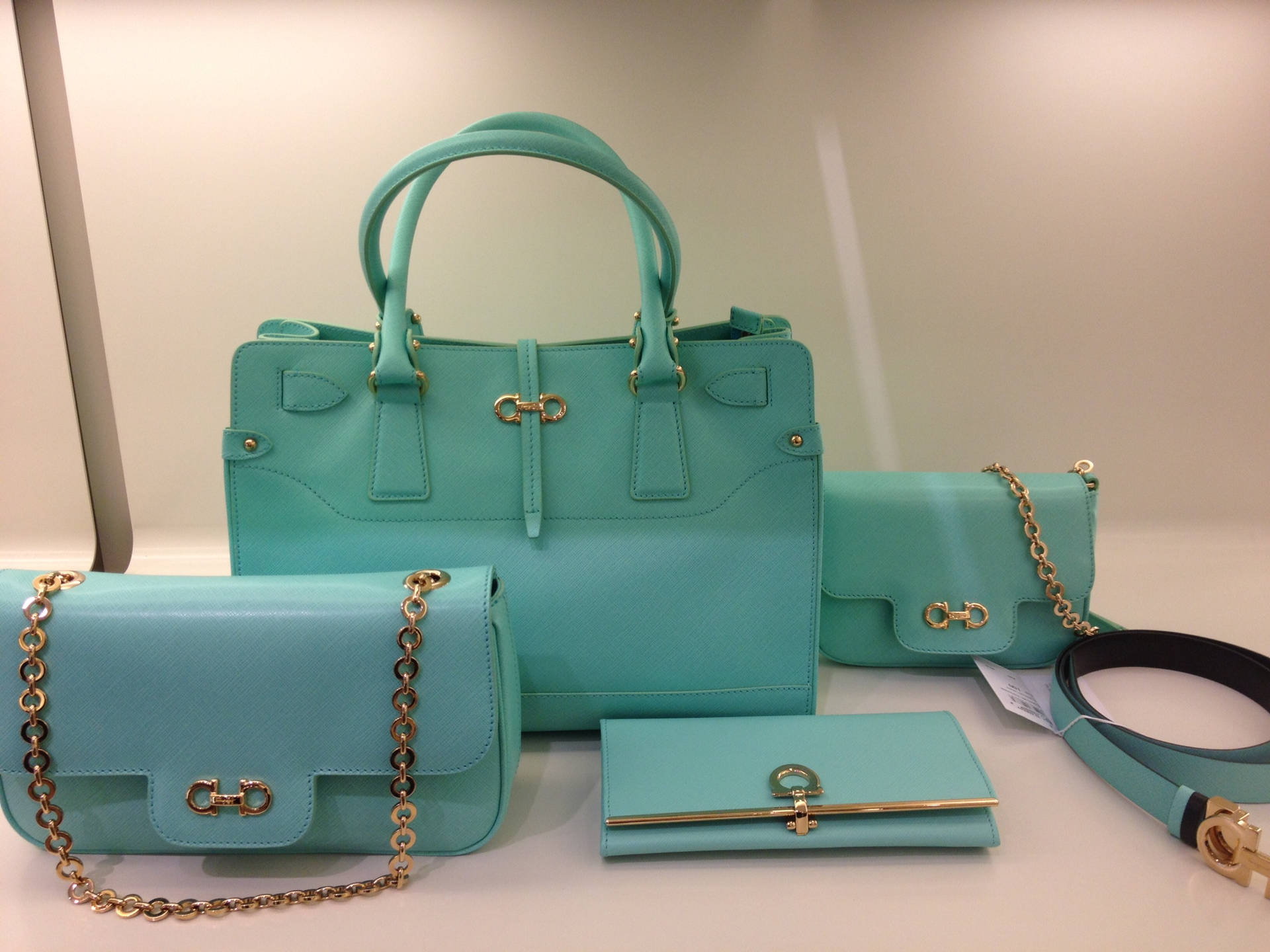 Salvatore Ferragamo Turquoise Bag Set Showcasing Elegance And Luxury Background