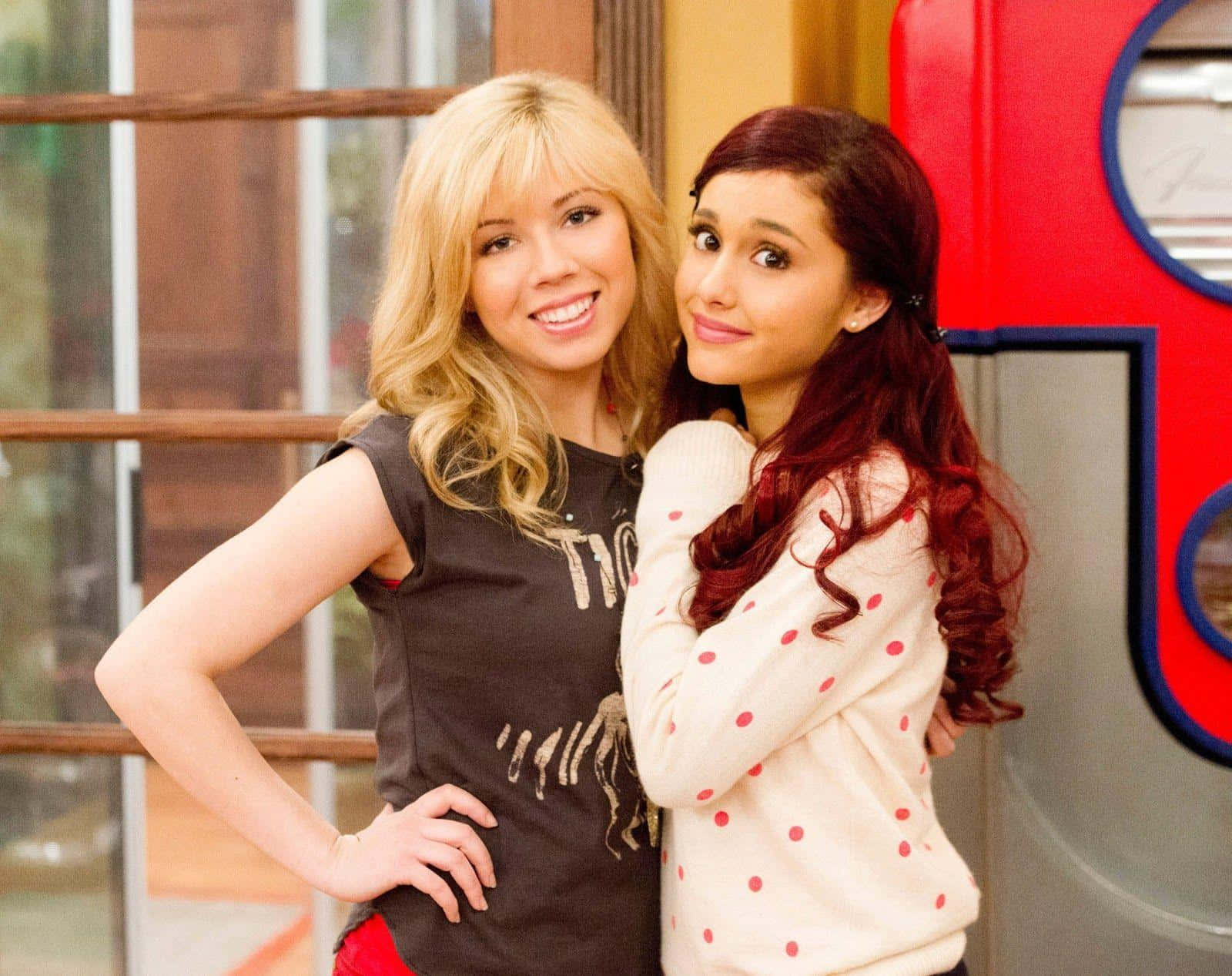 Sam And Cat Embracing As Best Friends Background