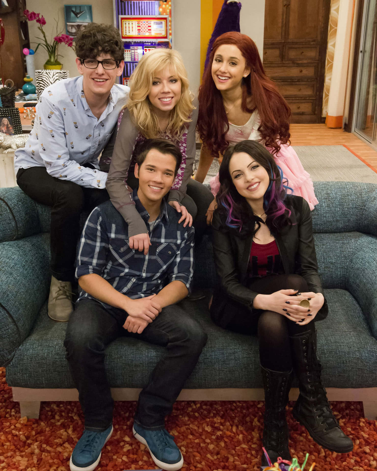 Sam And Cat Sitting On Couch Background