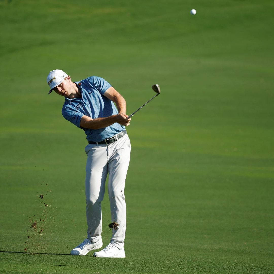 Sam Burns Executing A Breathtaking Golf Swing Background