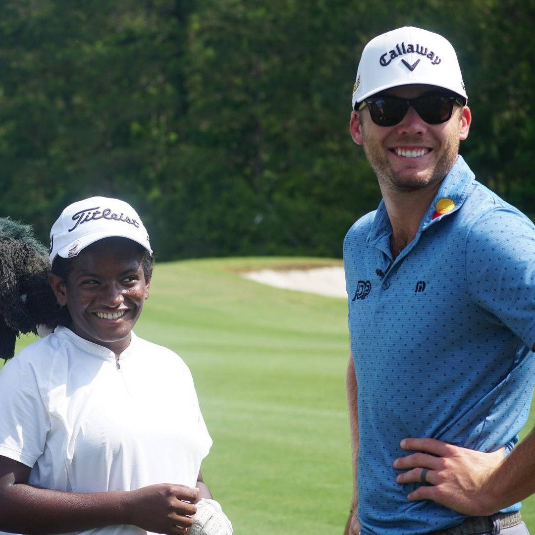 Sam Burns With African Child Background