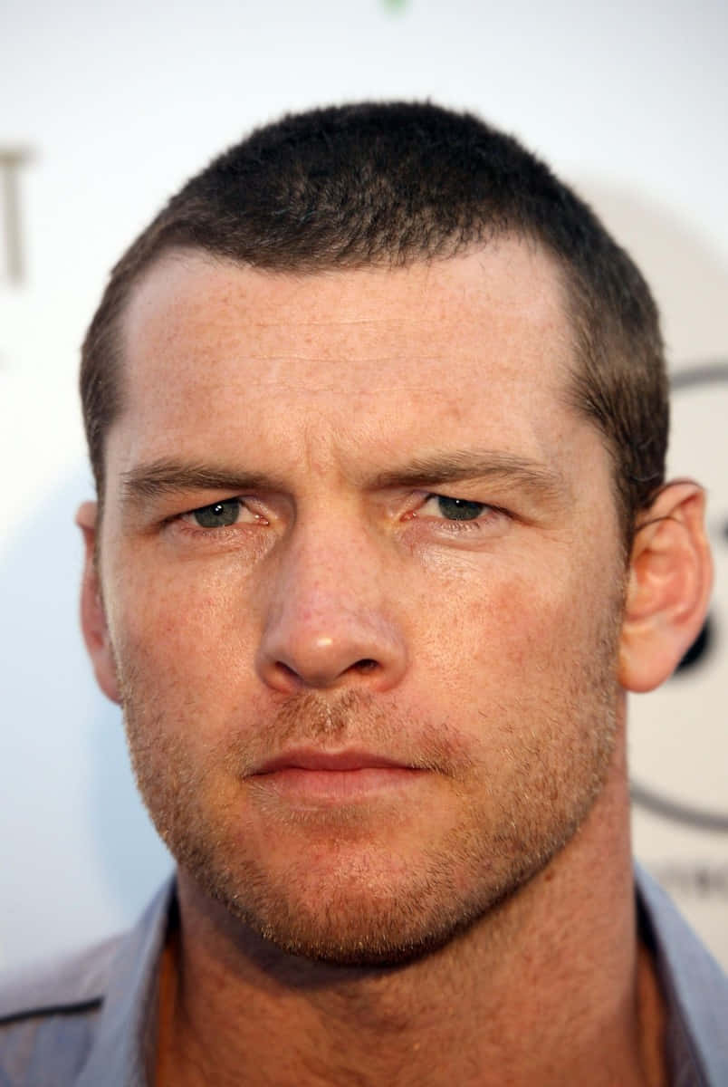 Sam Worthington Serious Face Profile Photo Background