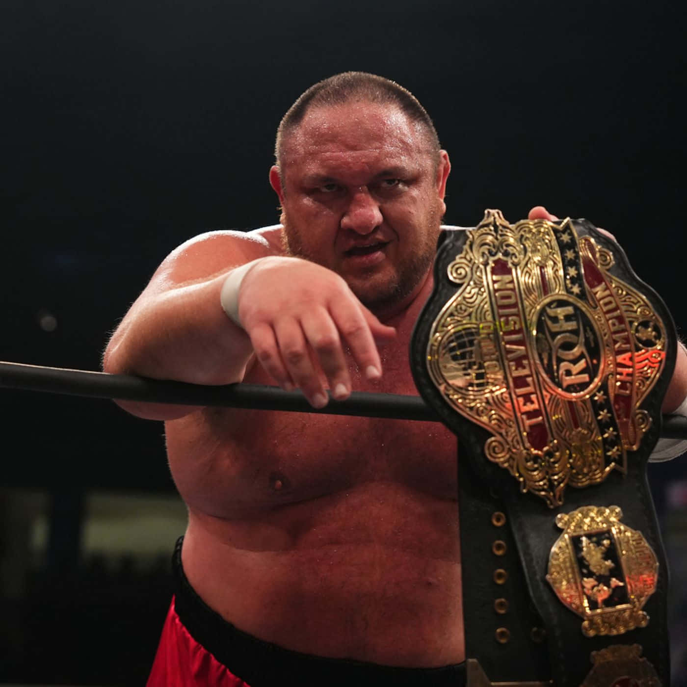 Samoa Joe Proudly Displaying The Roh Championship Belt Background