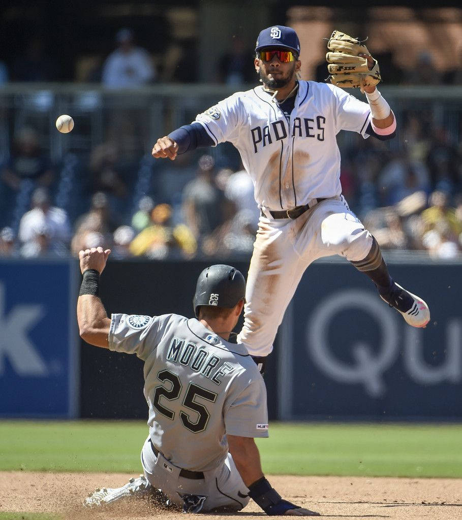 San Diego Padres Fernando Tatis Jr. And Dylan Moore Celebrate A Home Run. Background
