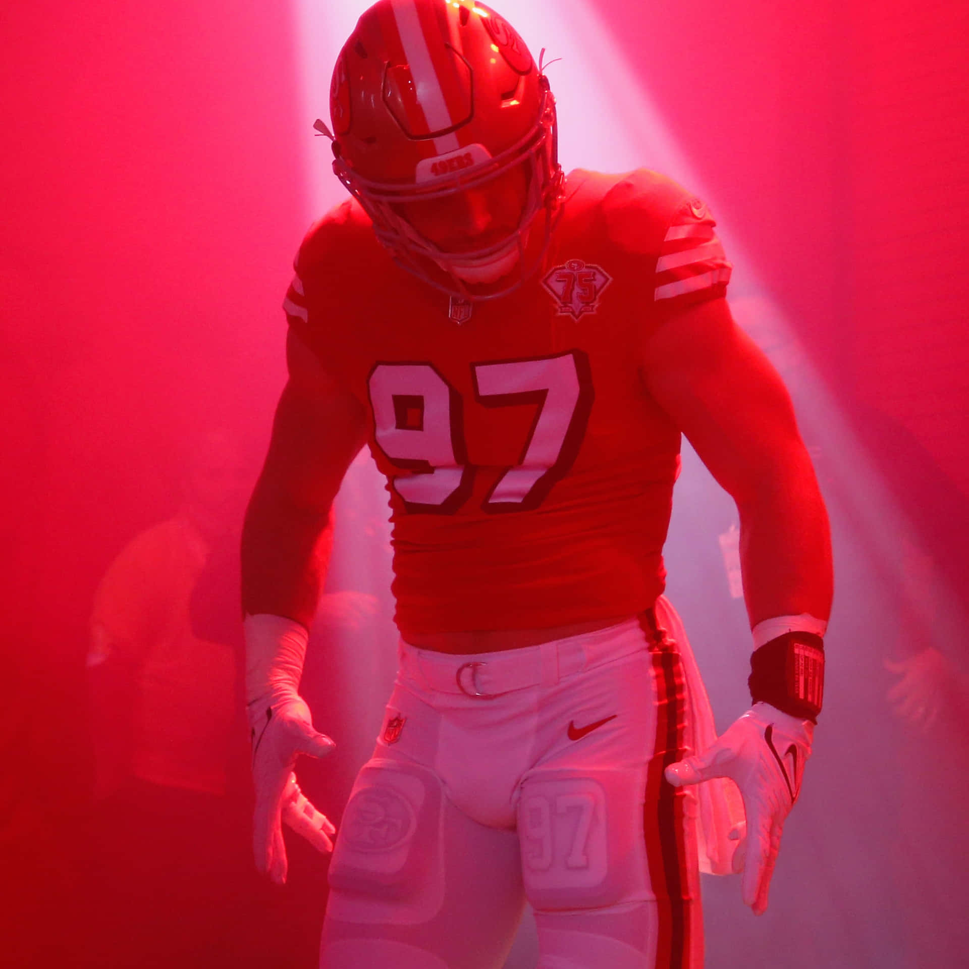 San Francisco 49ers Defensive End Nick Bosa Warms Up Before A Game Background
