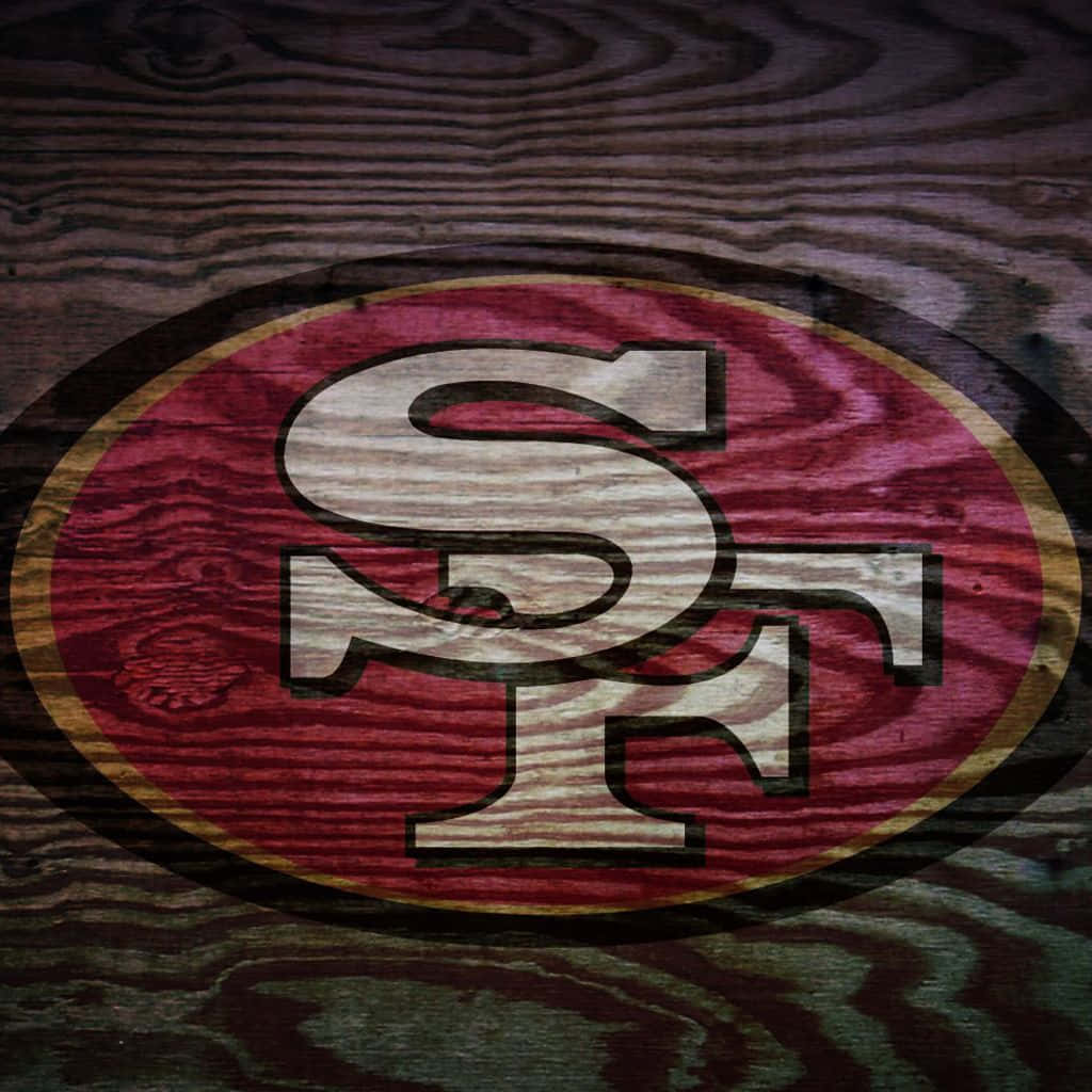 San Francisco 49ers Logo On A Wooden Background Background