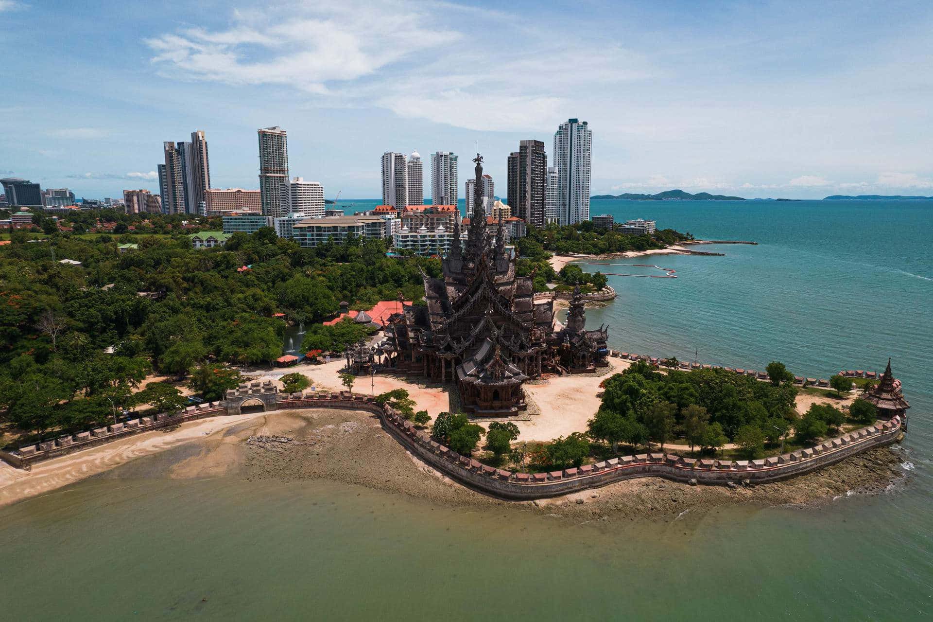 Sanctuary Of Truth By The Beach In Thailand Background