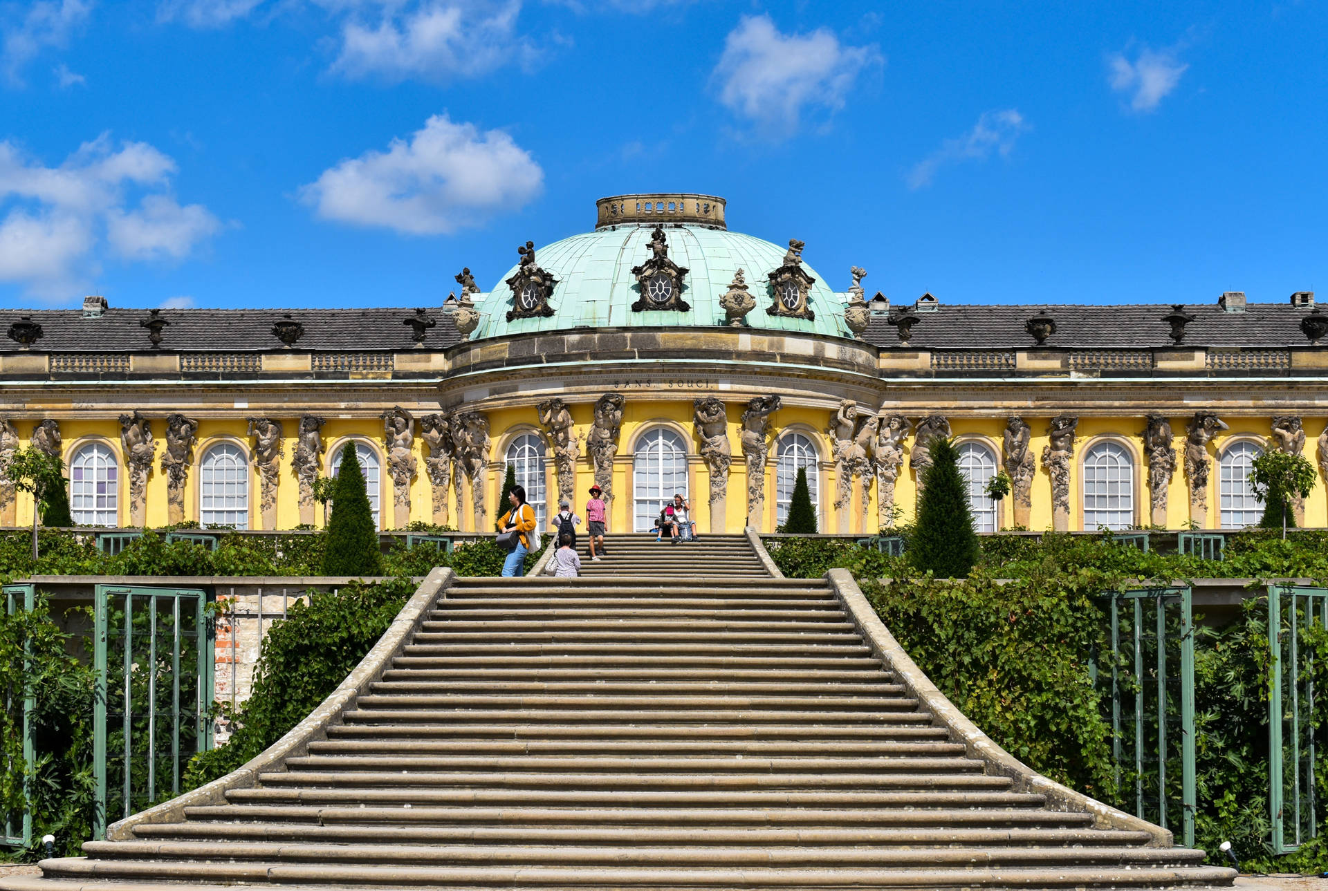 Sanssouci Palace Potsdam With Tourists Background