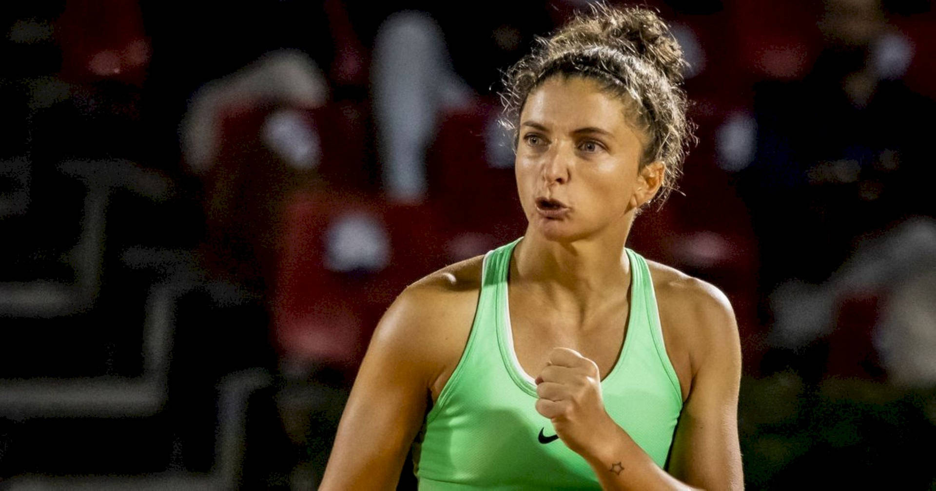 Sara Errani Determined Clenched Fist Background