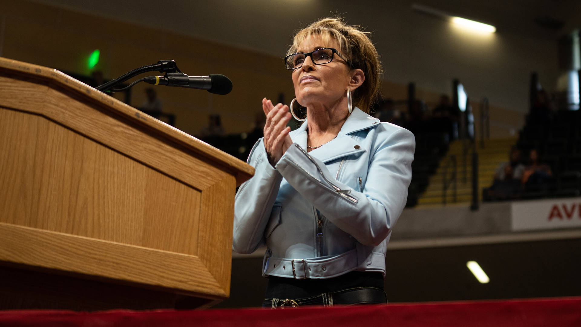 Sarah Palin Clapping At Lectern Background