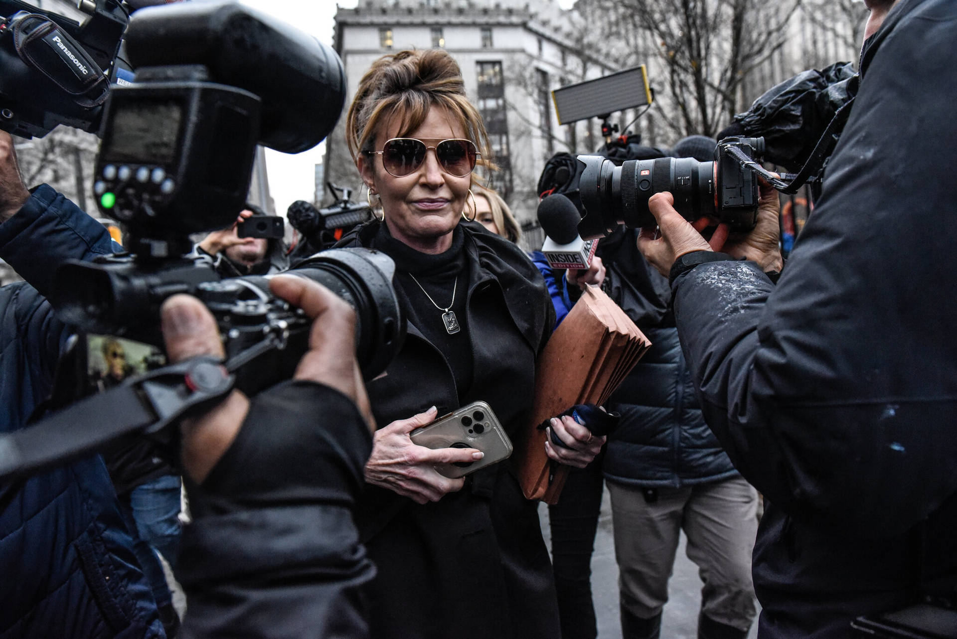 Sarah Palin Crowded By Media Background