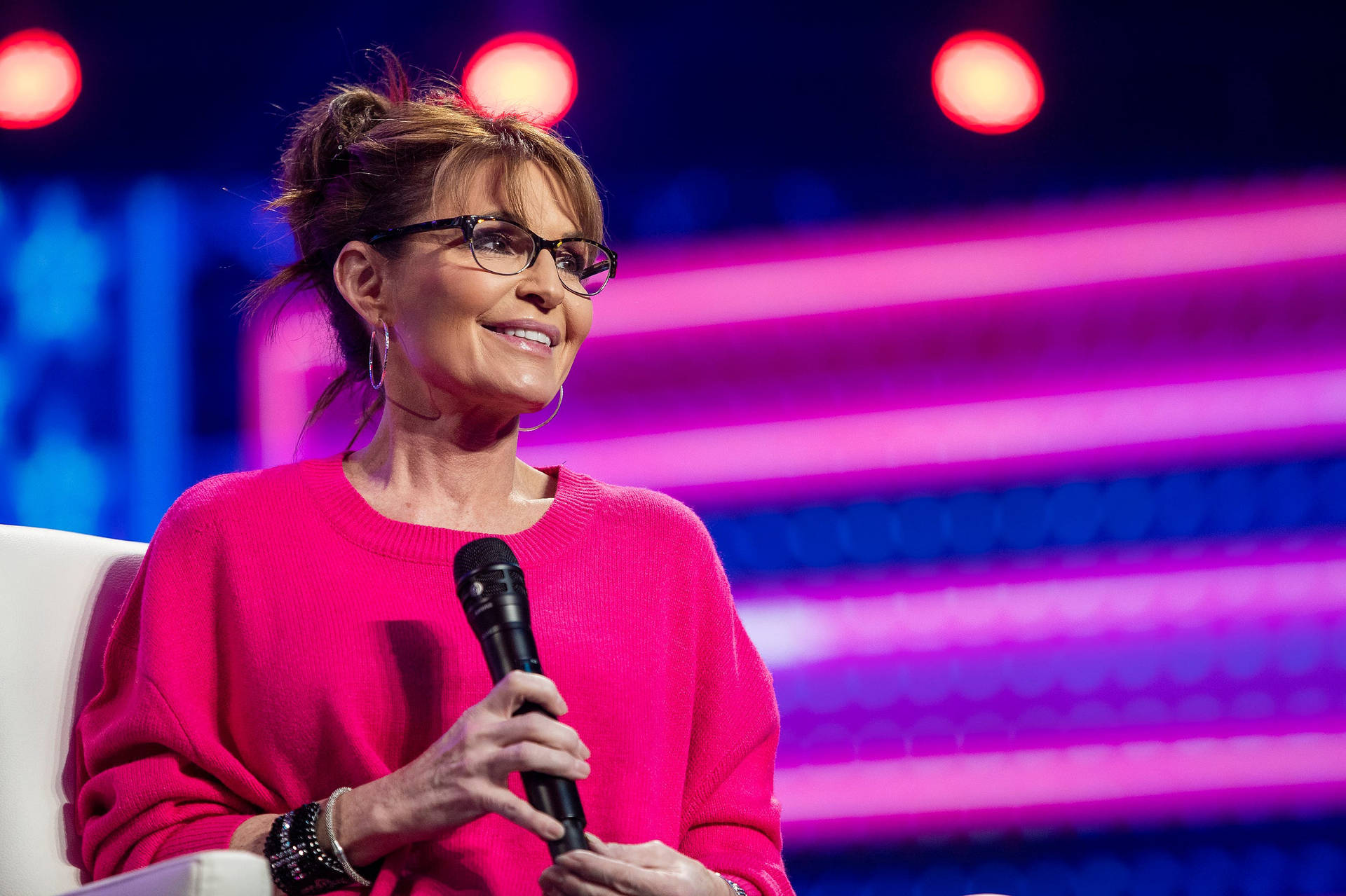 Sarah Palin Smiling While Holding Microphone Background