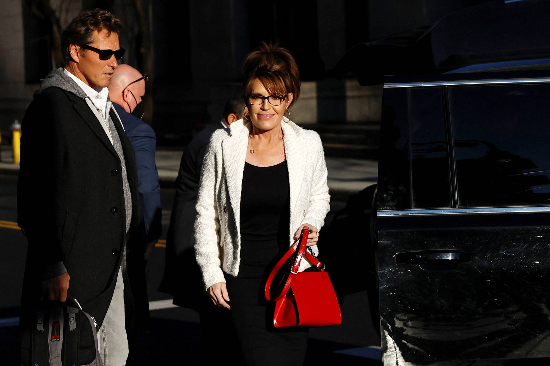 Sarah Palin Stepping Out From A Car Background