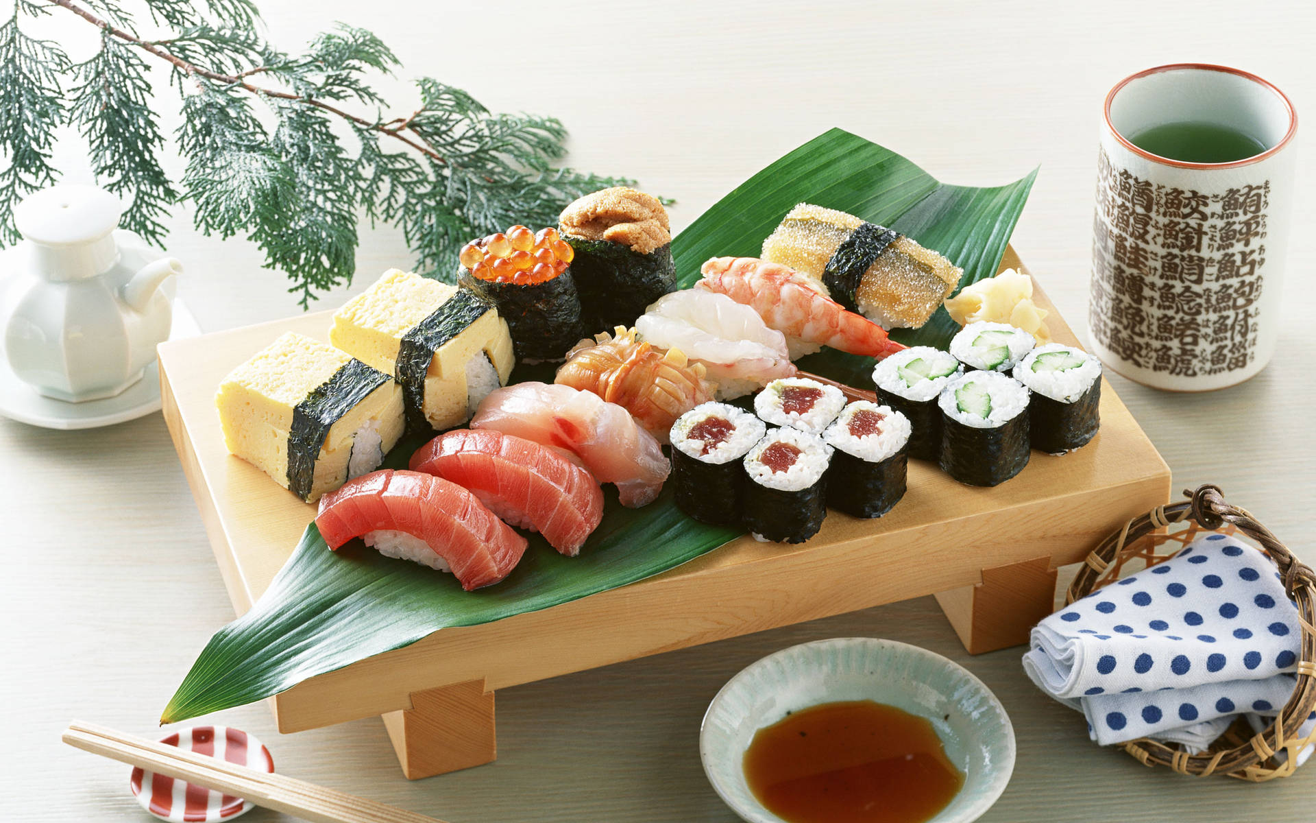 Sashimi And Sushi On A Small Wooden Table Background