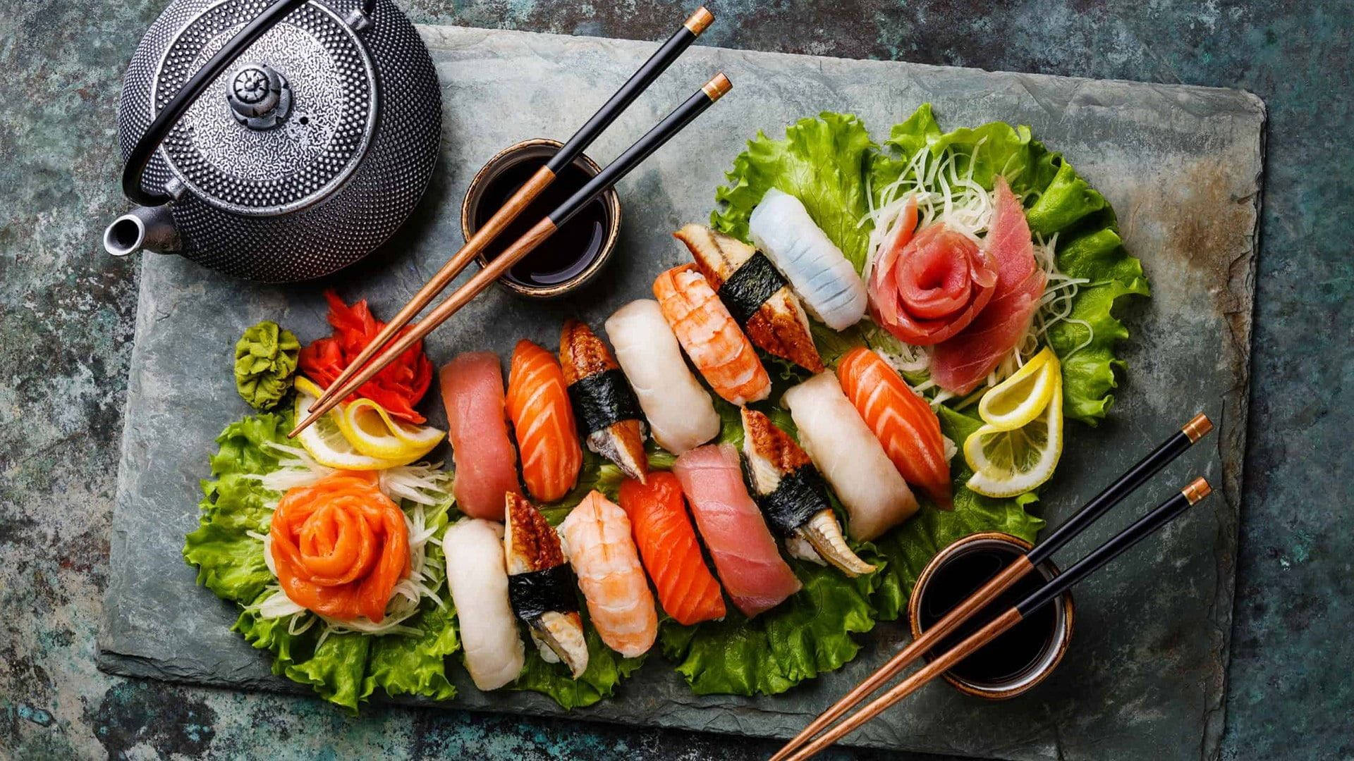 Sashimi Meal With Lettuce And Tea Background