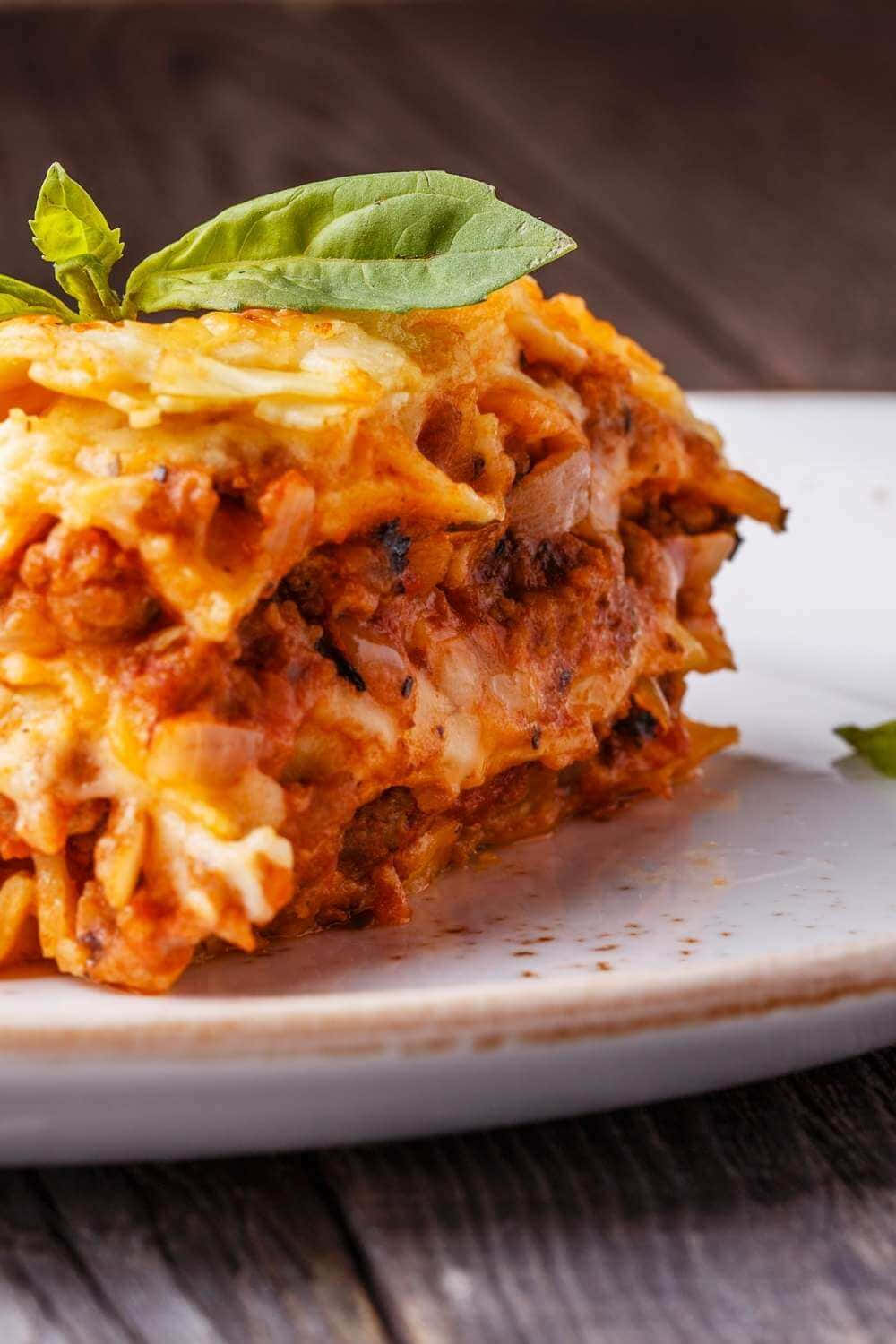 Satisfying Slice Of Authentic Lasagna Alla Bolognese Background