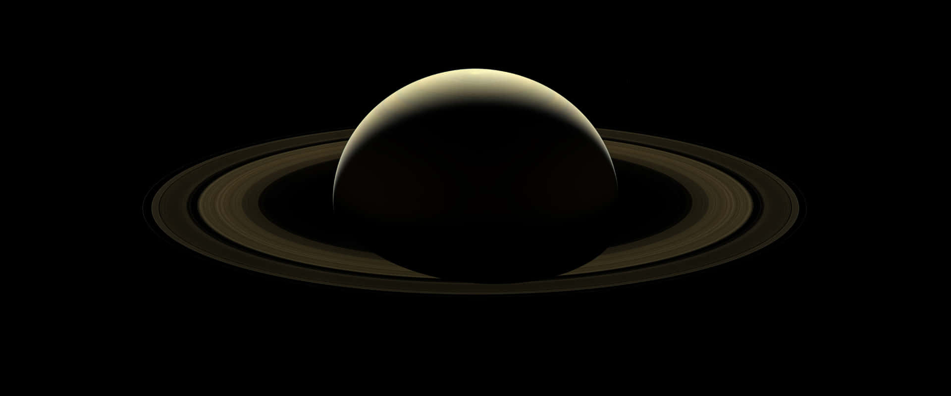 Saturn Silhouette Against Sunlight Background
