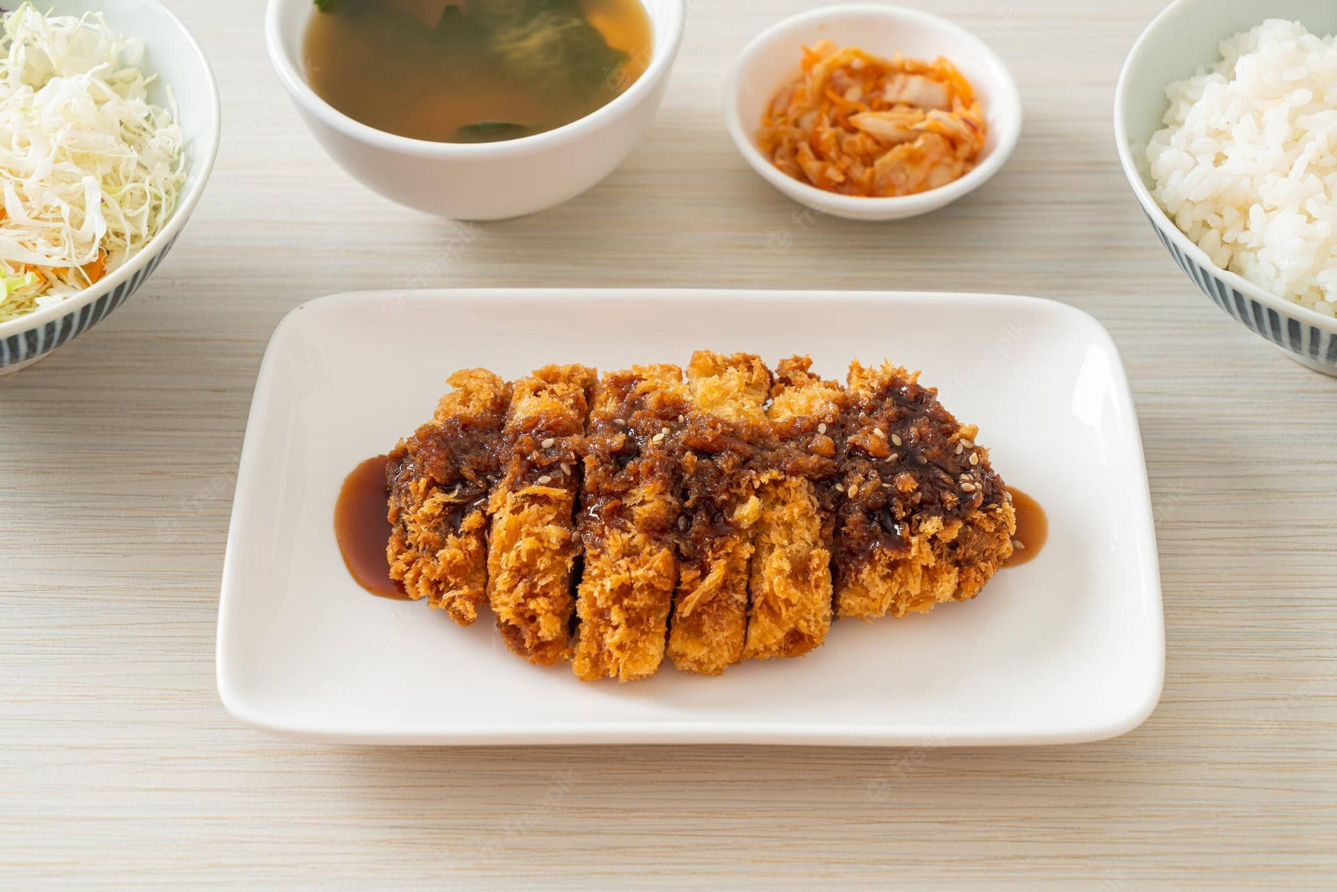 Saucy Japanese Tonkatsu On A Rectangular Plate Background