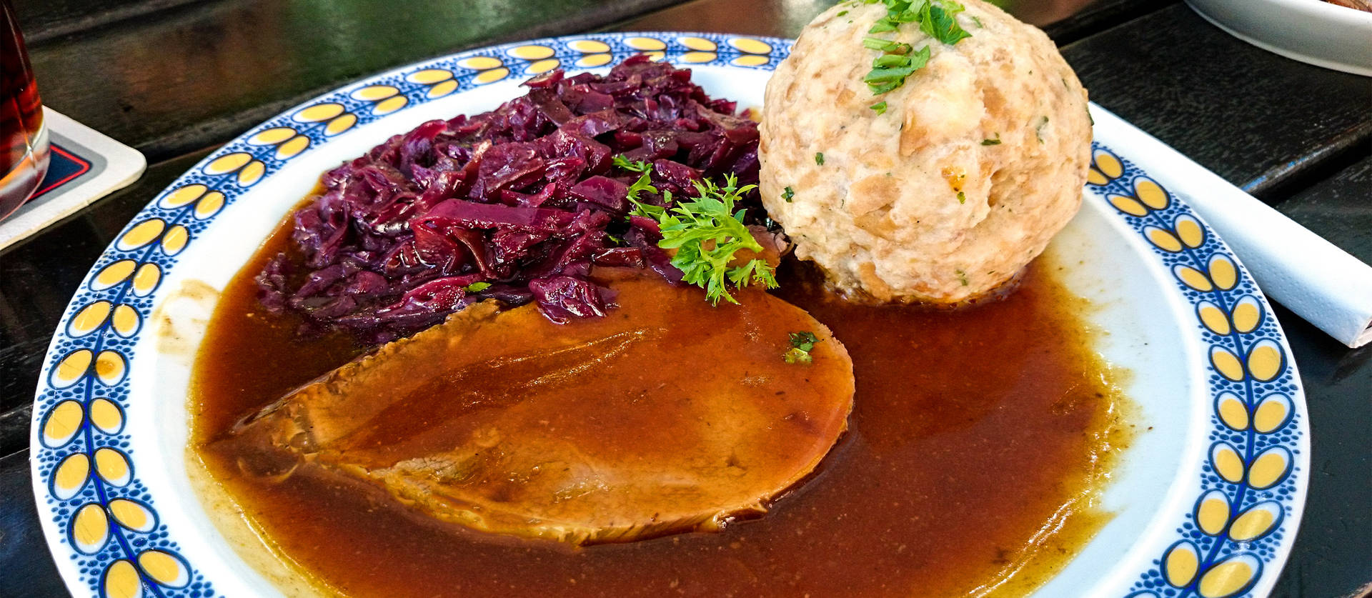 Sauerbraten Traditional German Dish Drenched In Gravy Background