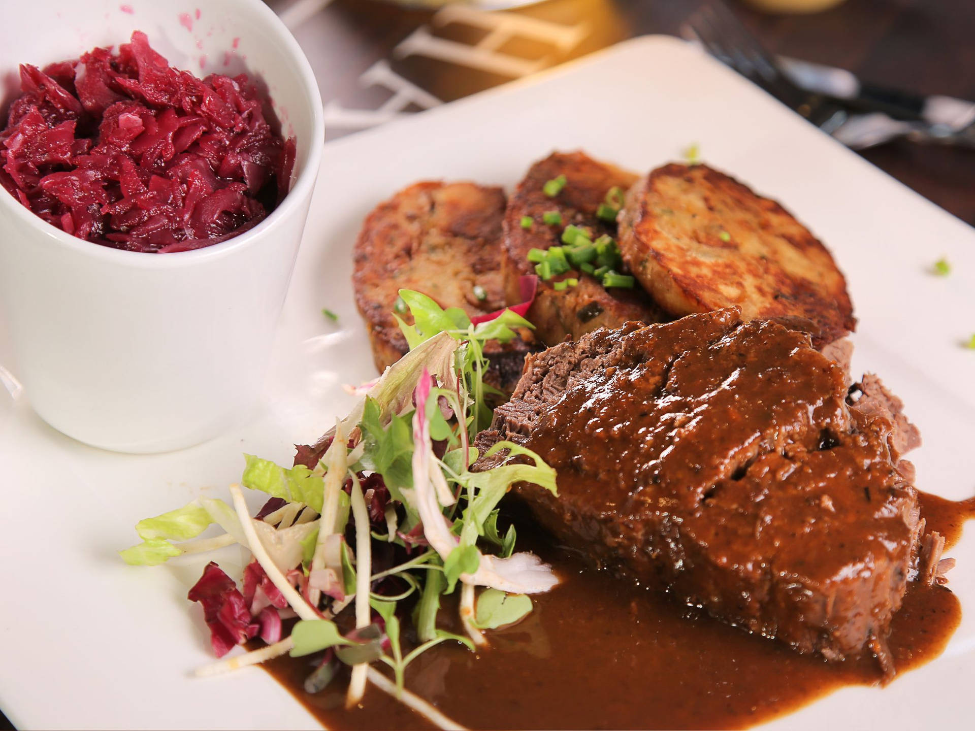 Sauerbraten Traditional German Dish Red Cabbage And Endive Background