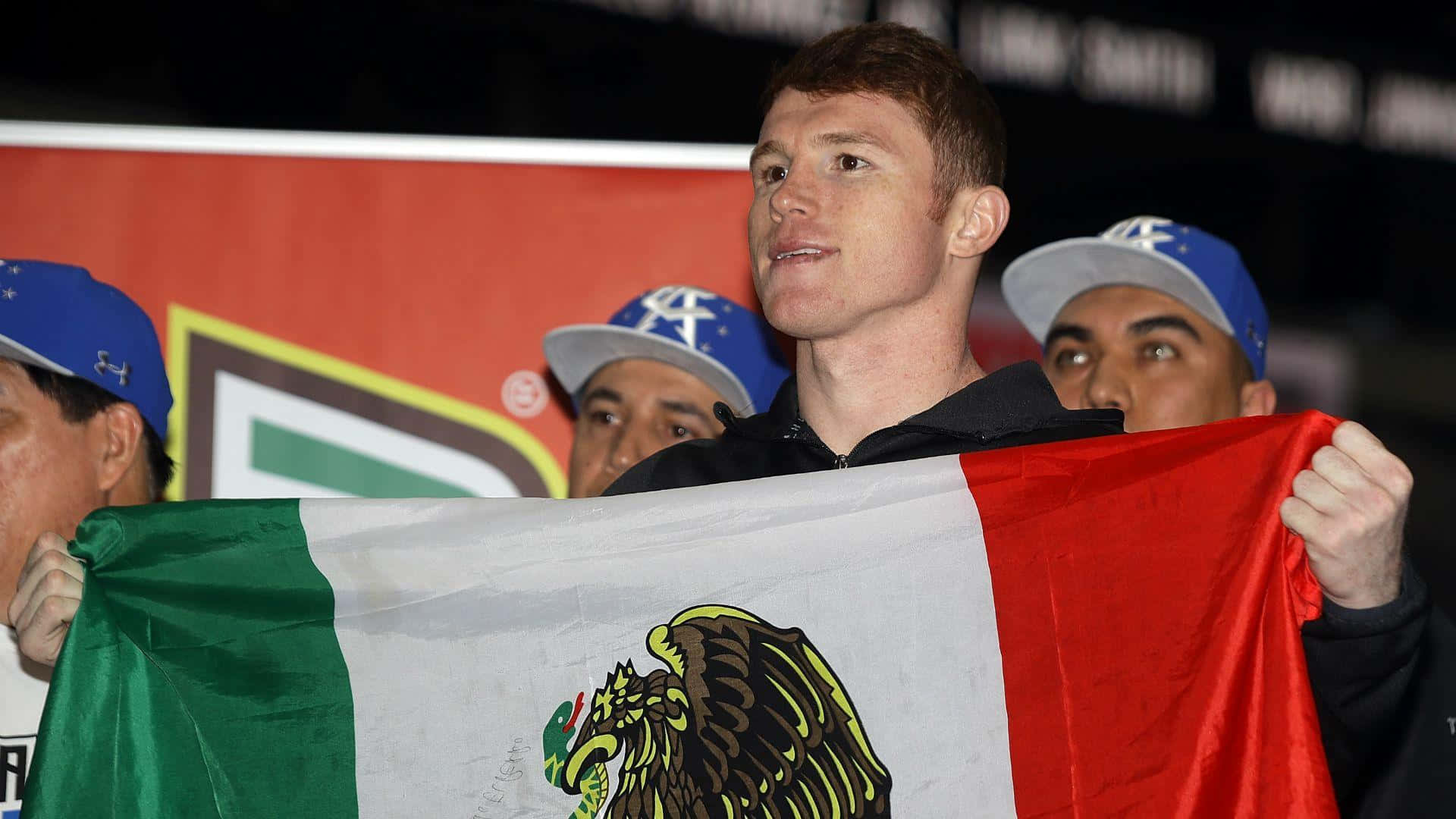 Saul Canelo Alvarez Proudly Holding The Flag Of His Homeland Background