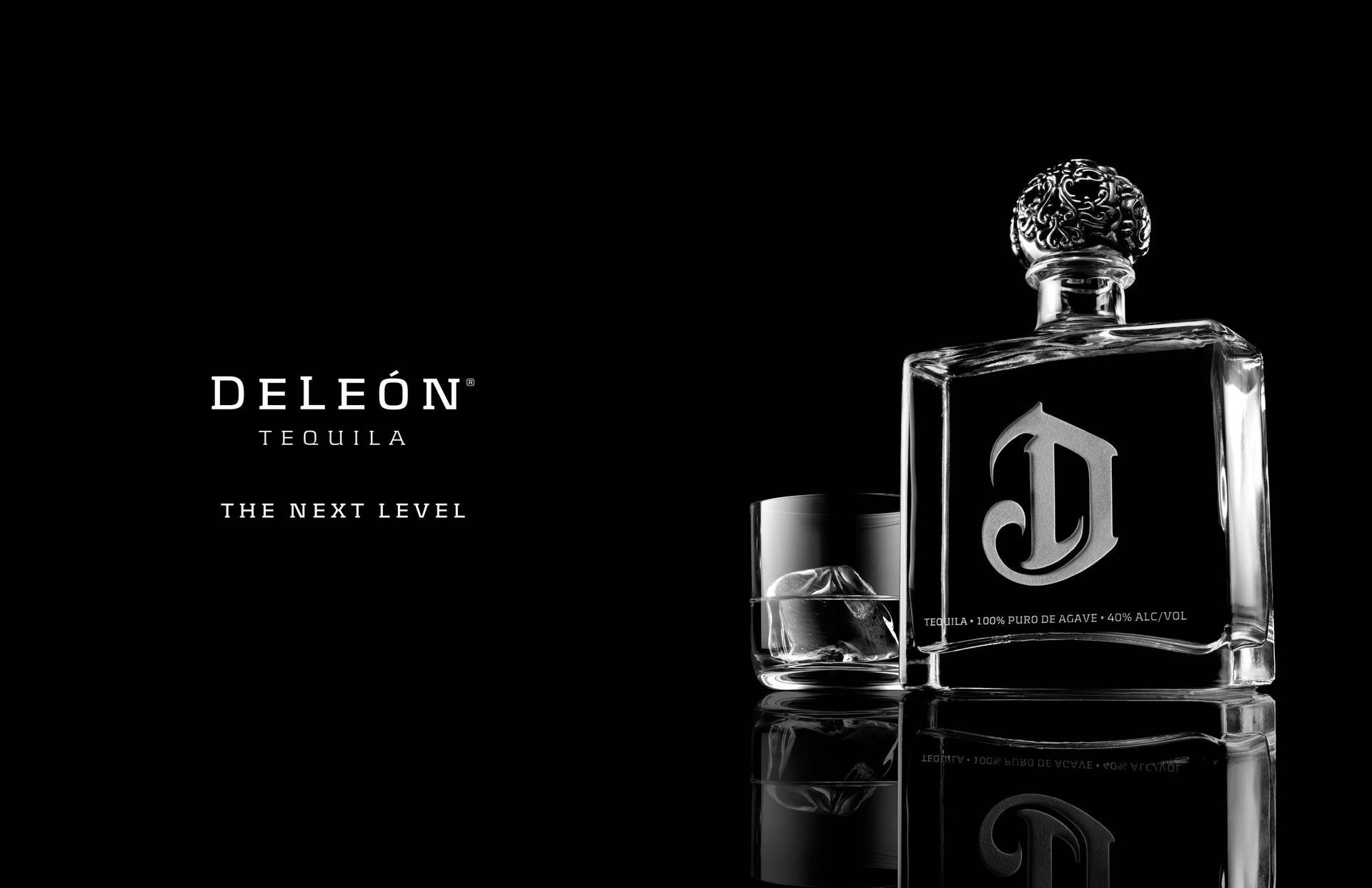 Savoring Luxury With Deleon Tequila Bottle And Glass