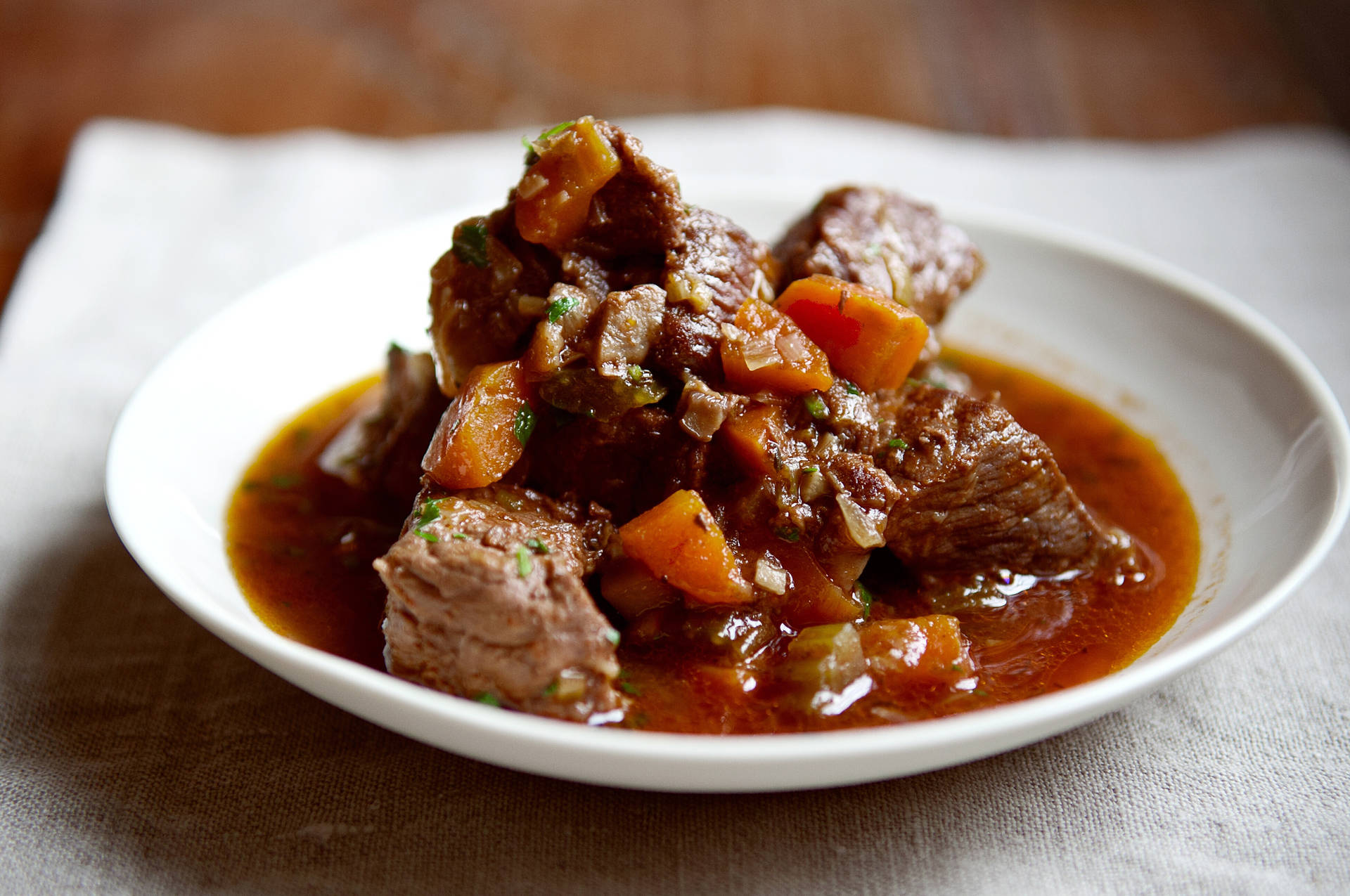 Savory Beef Bourguignon In A Dutch Oven Background