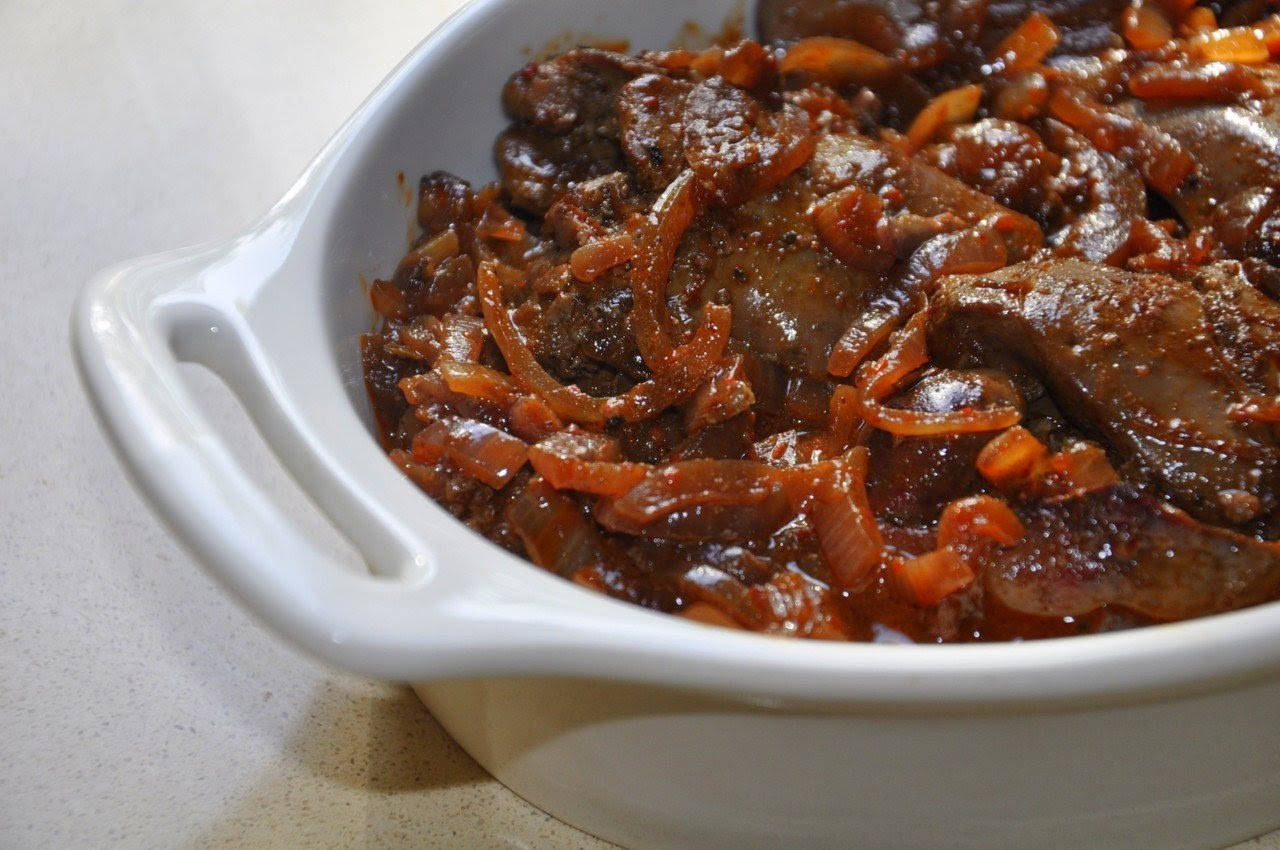 Savory Chicken Livers In Red Wine Background