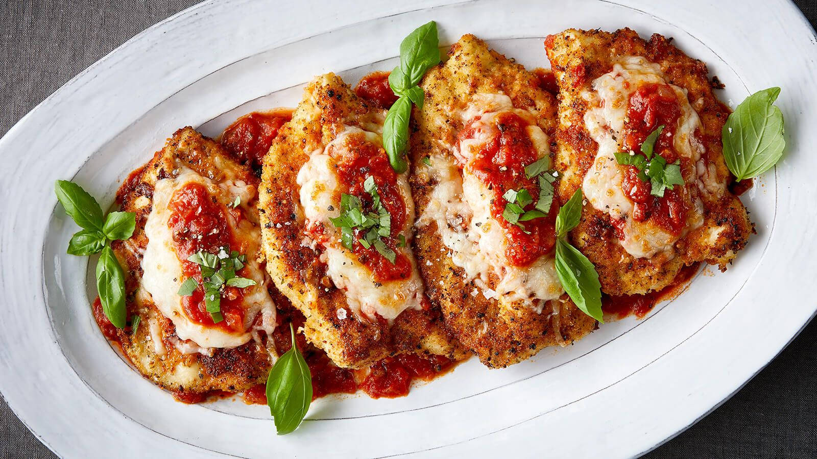 Savory Chicken Parmigiana Freshly Cooked To A Golden Crisp Background