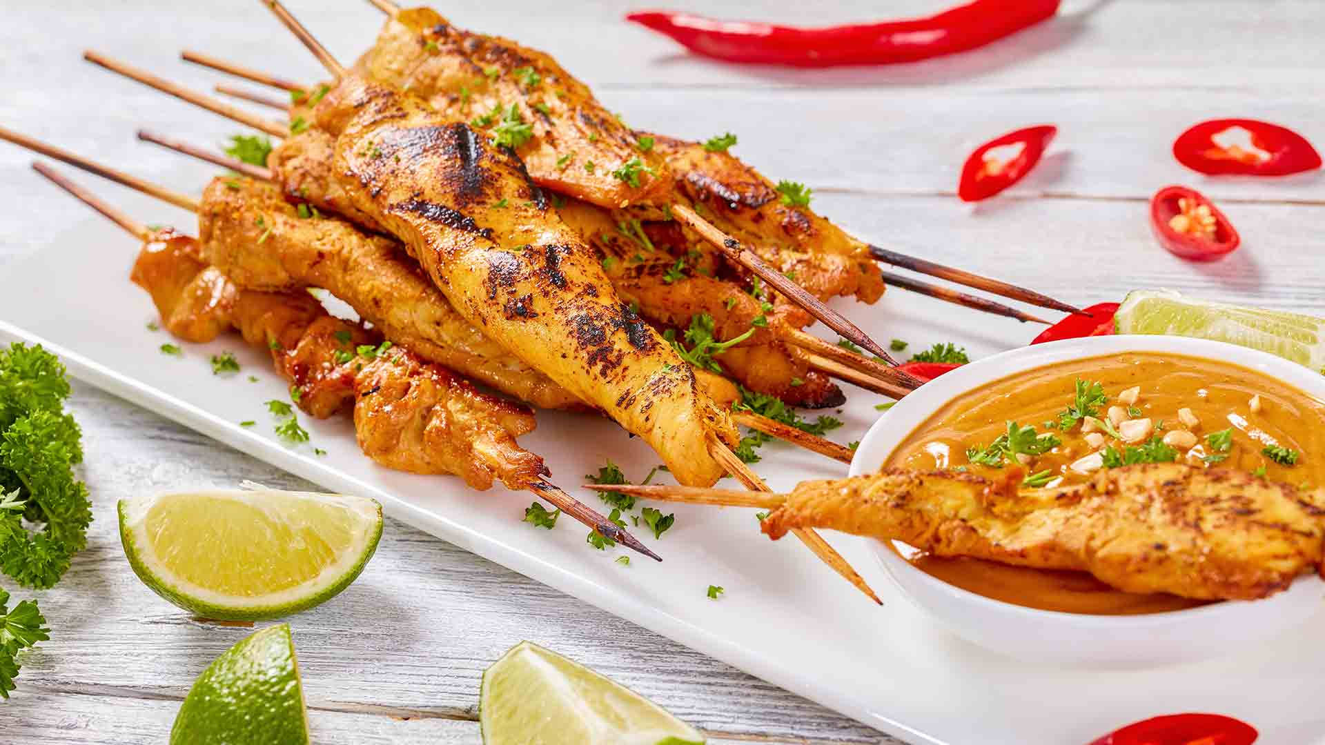 Savory Chicken Satay With Tangy Lemon And Spicy Red Chili Background