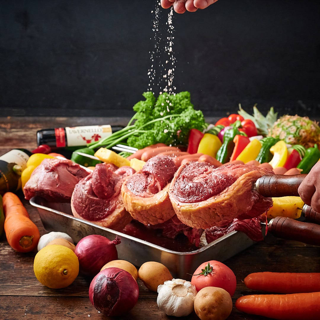 Savory Delight: Seasoned Churrasco Ready To Grill Background