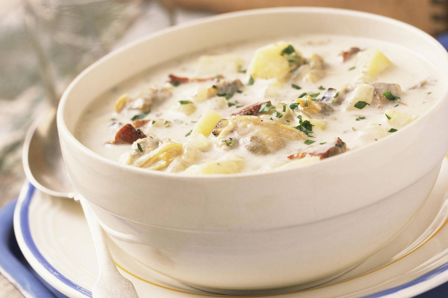 Savory New England Clam Chowder Served In A Bowl Background