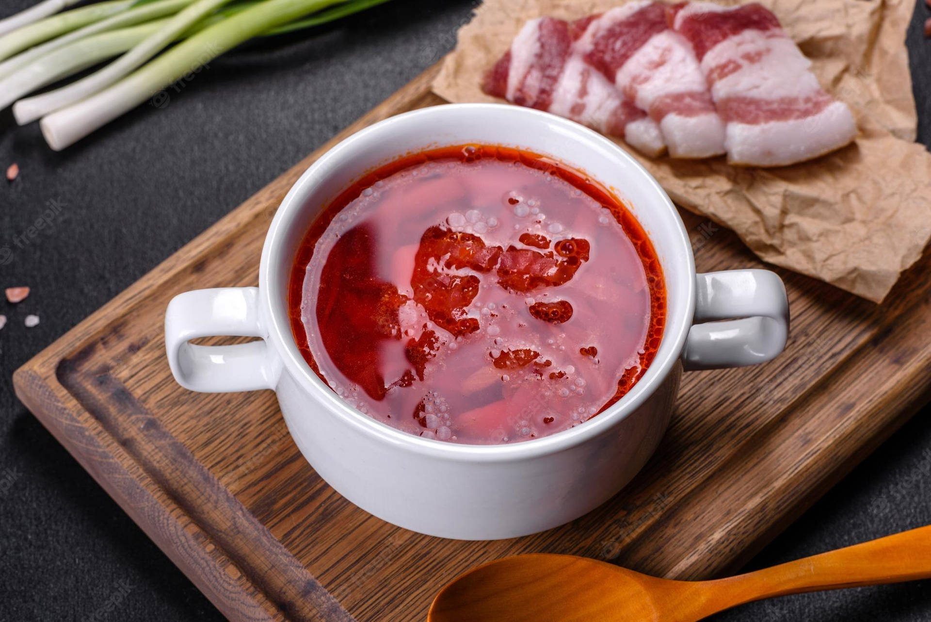 Savory Pork Borscht Dish On Table Background