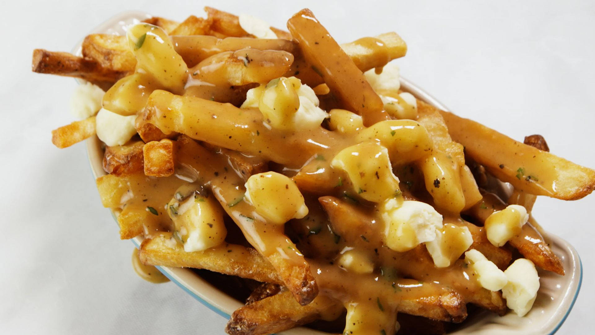 Savory Poutine Platter With Gravy And Fries Background