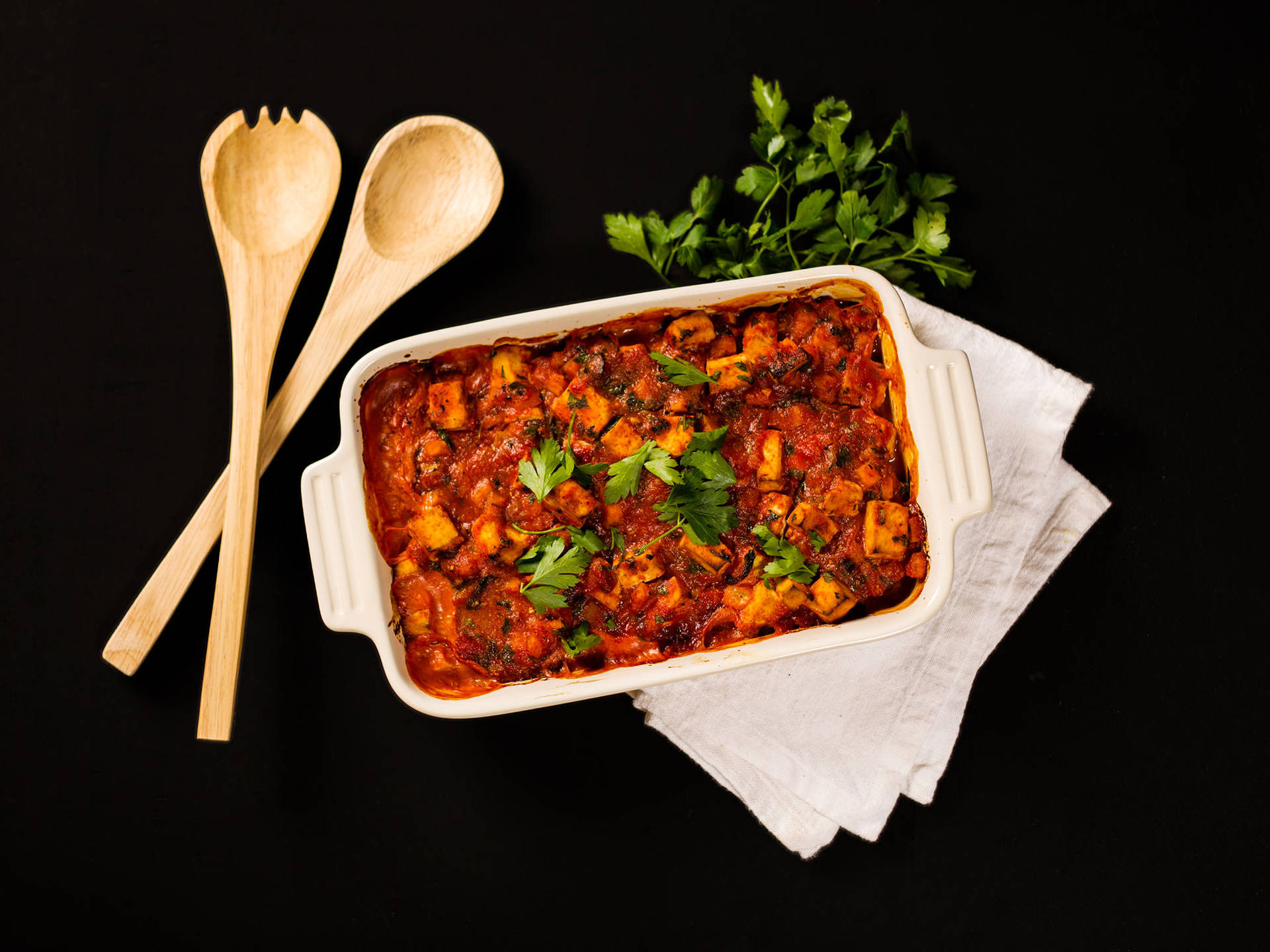 Savory Tray Of Moussaka On A Dark Surface Background