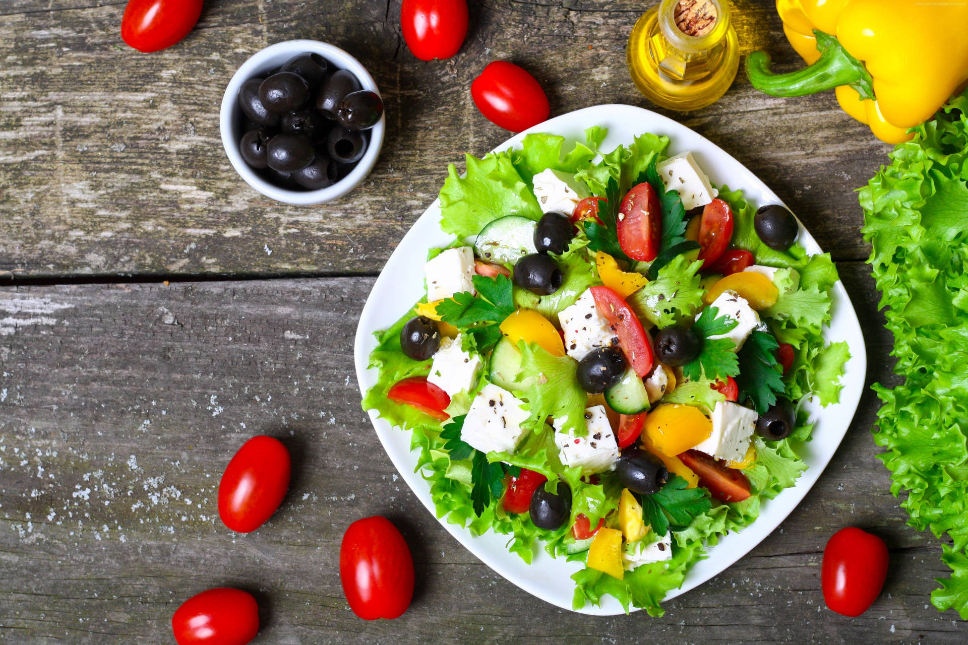 Savour The Goodness Of This Freshly Prepared Healthy Salad Background